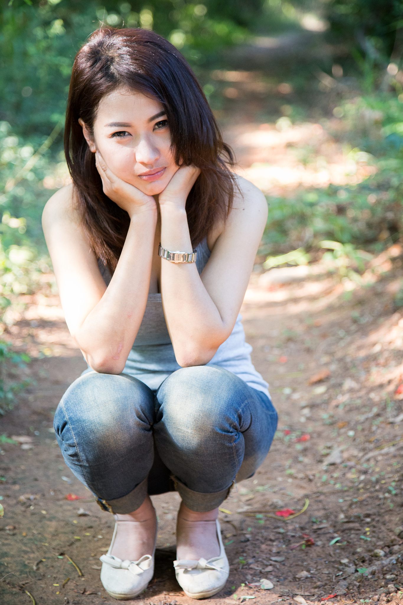 beautiful young woman  is in the green forest