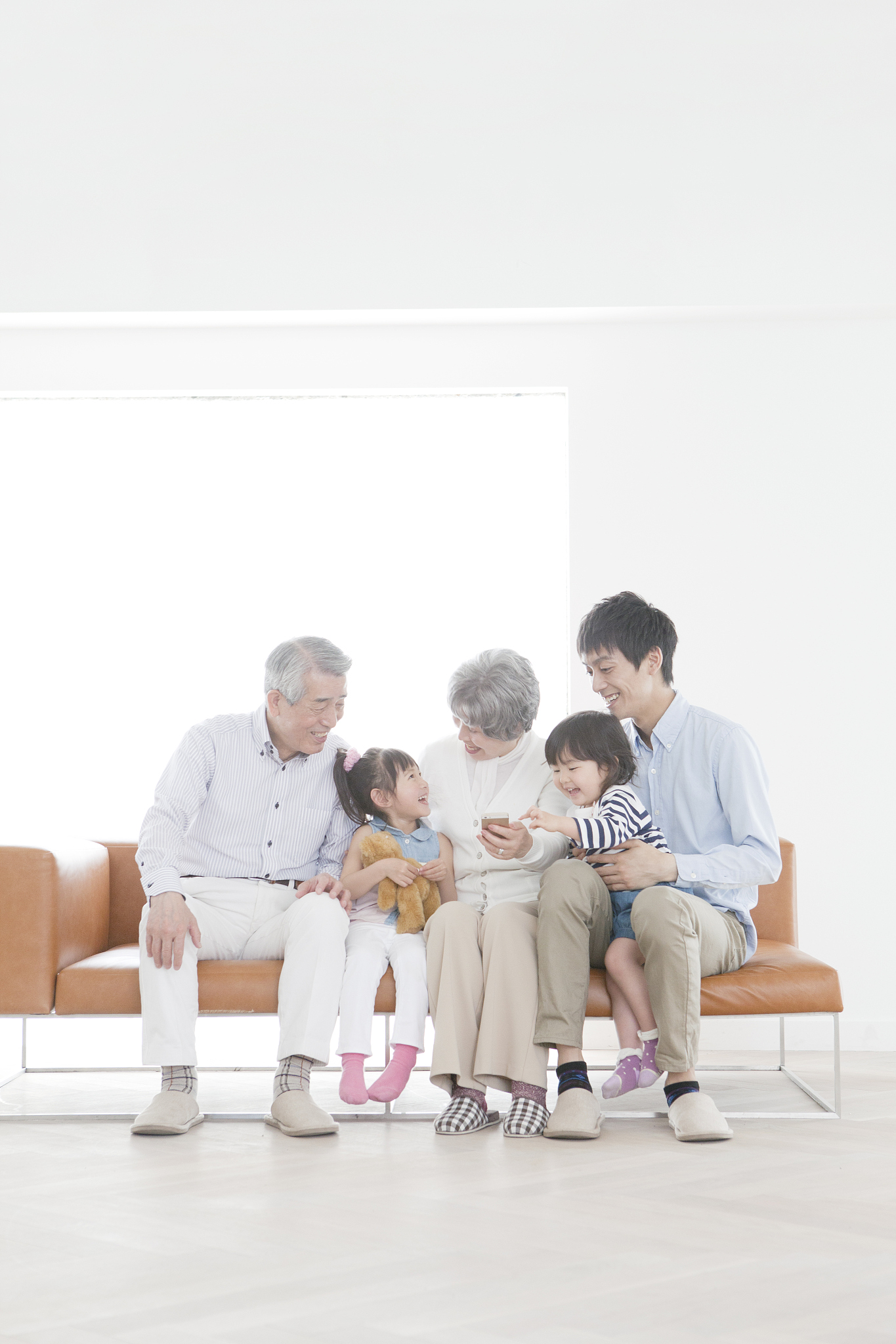 a family sitting on a sofa