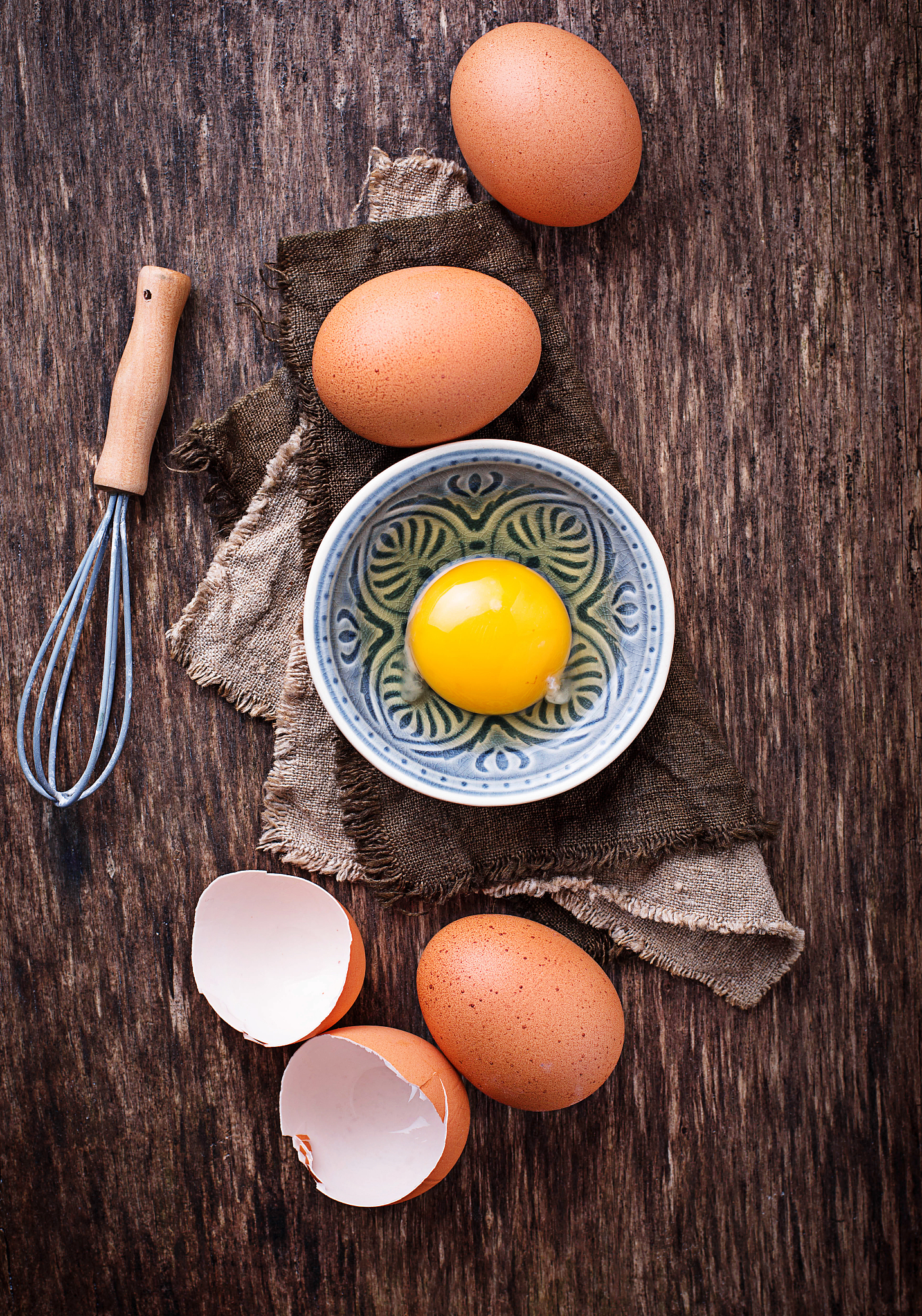 raw chicken eggs and whisk