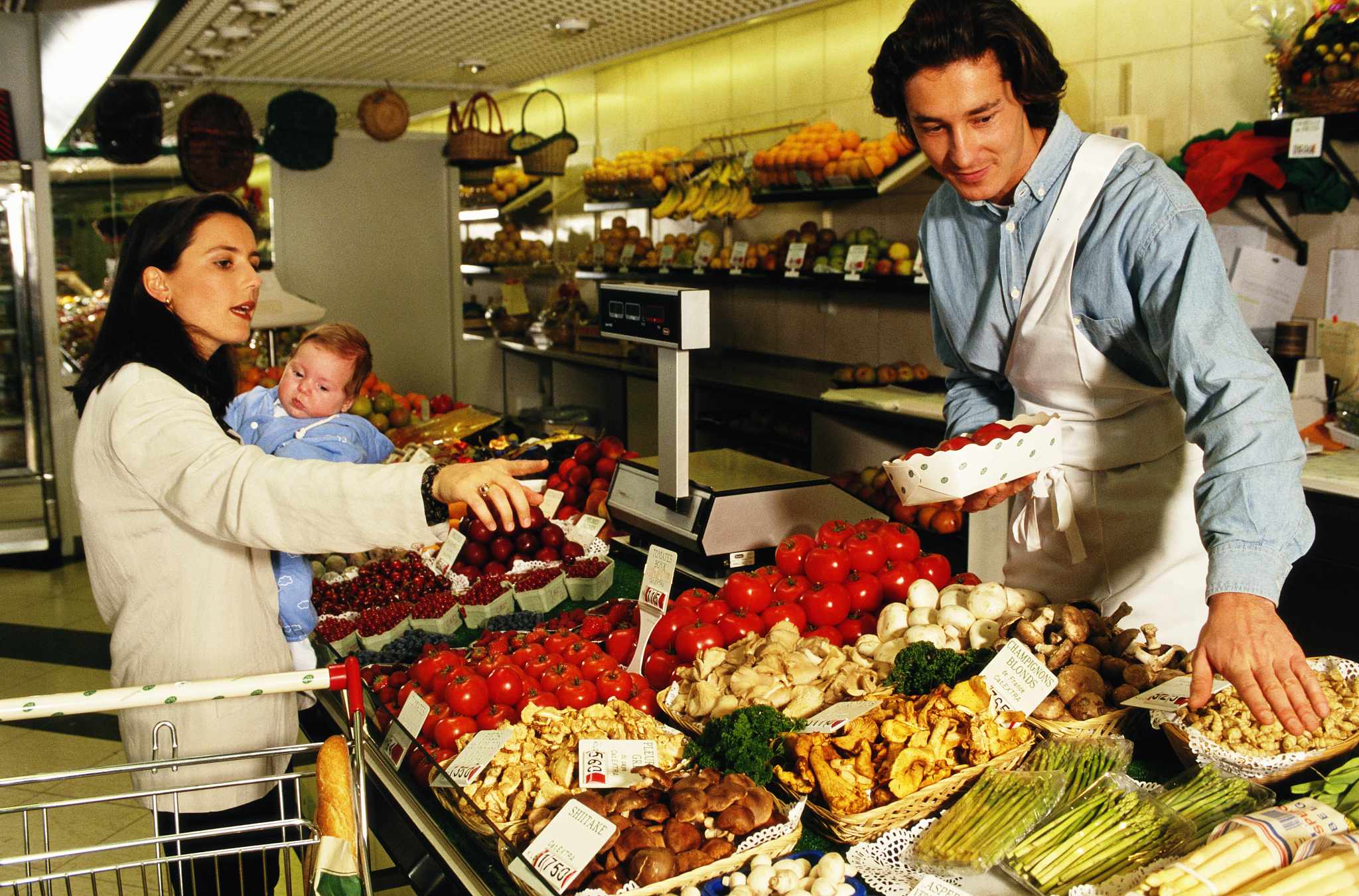 mother and baby at store with employee