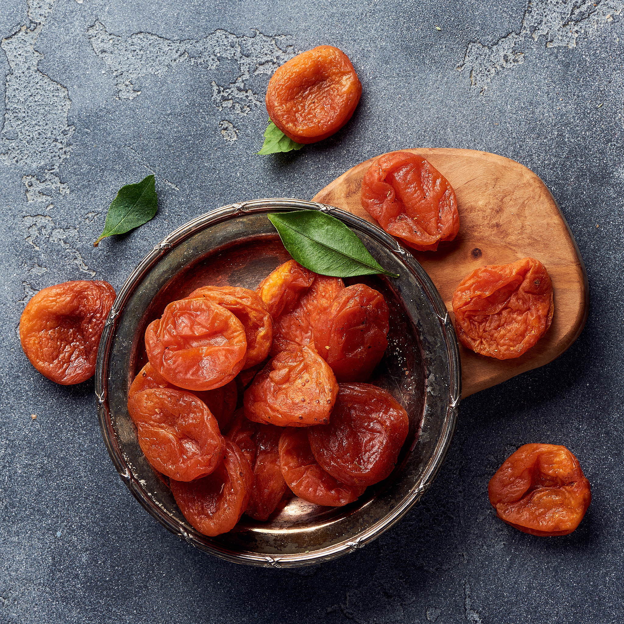 dried apricots on gray background with copy space. top view.
