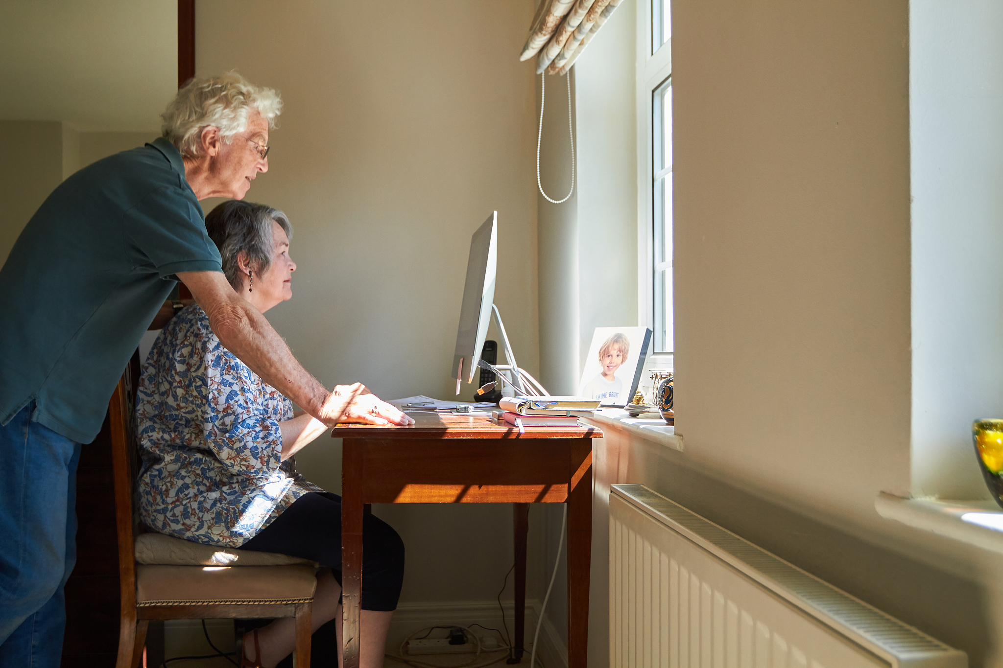 senior couple using a computer