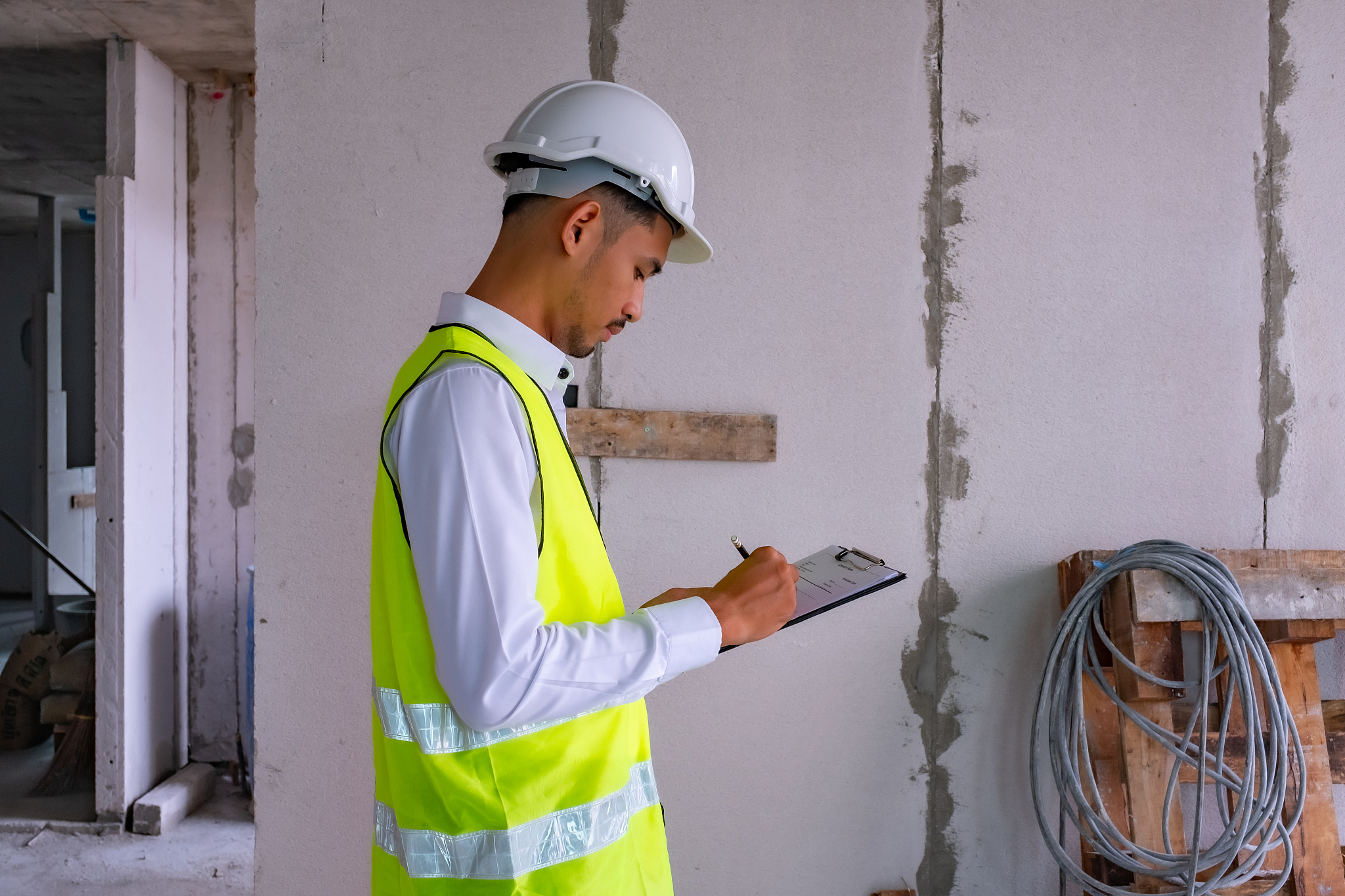 civil engineer is inspecting in building site