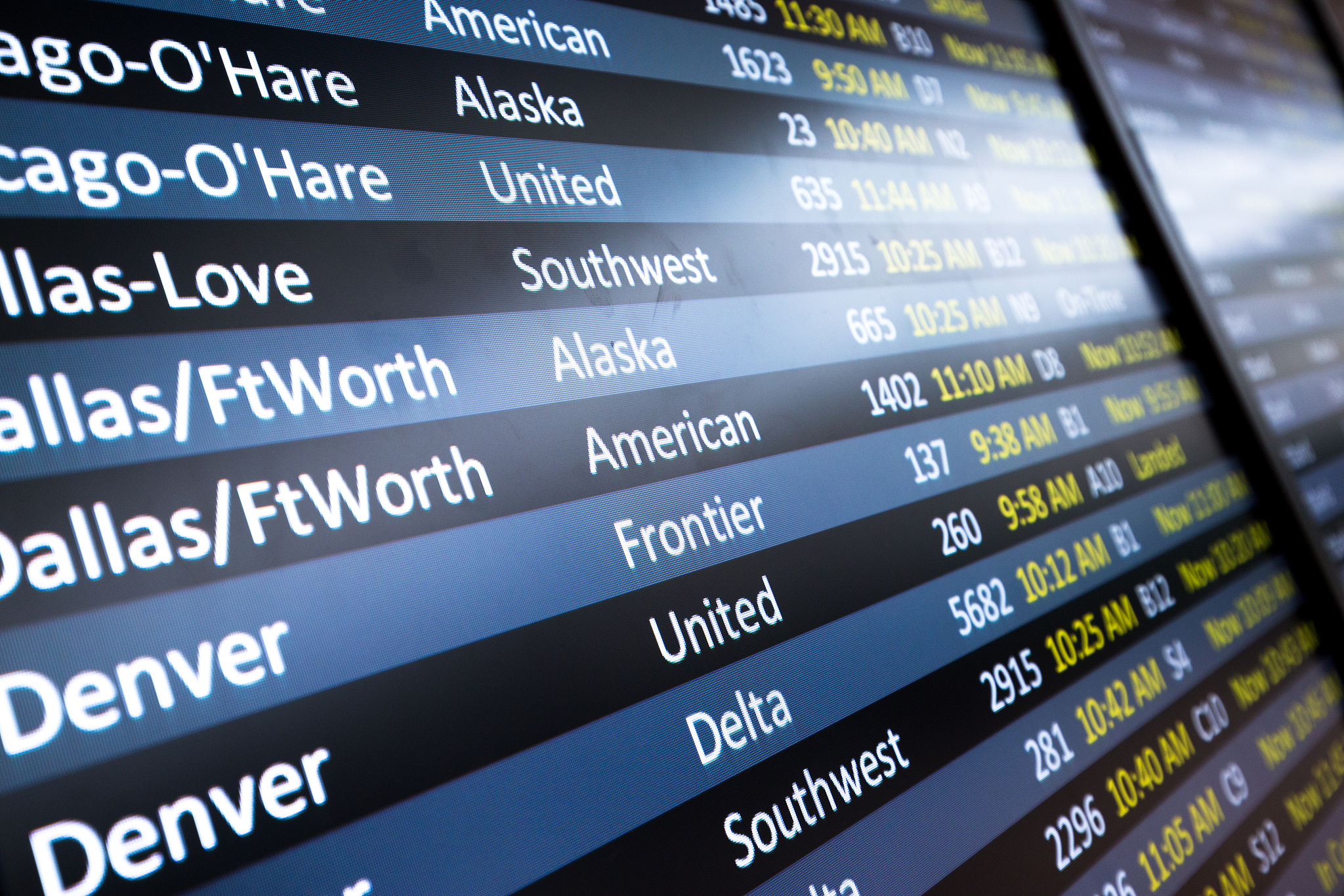flight information on billboard in airport