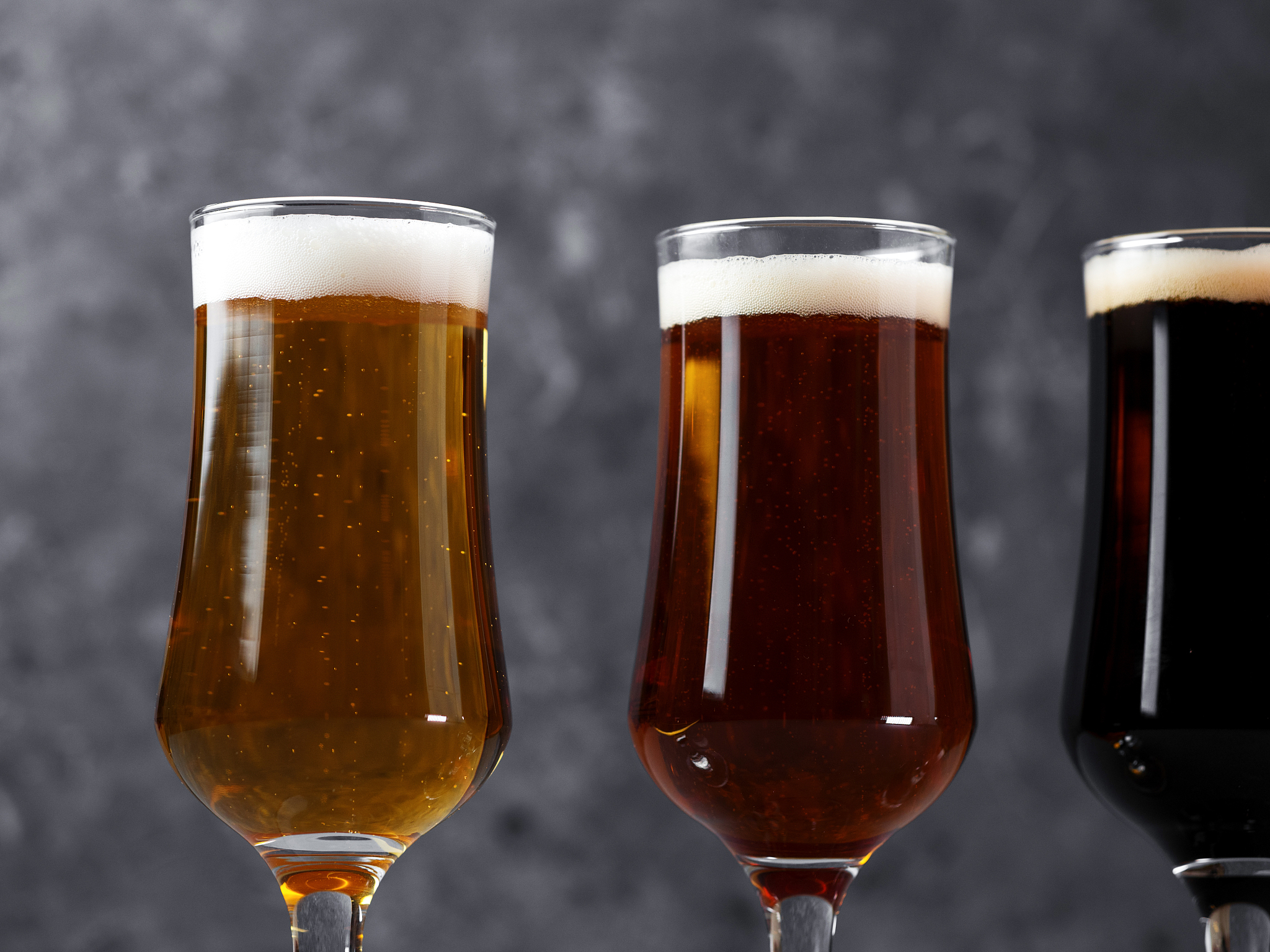 choose from three different types of craft beer in glasses on a 