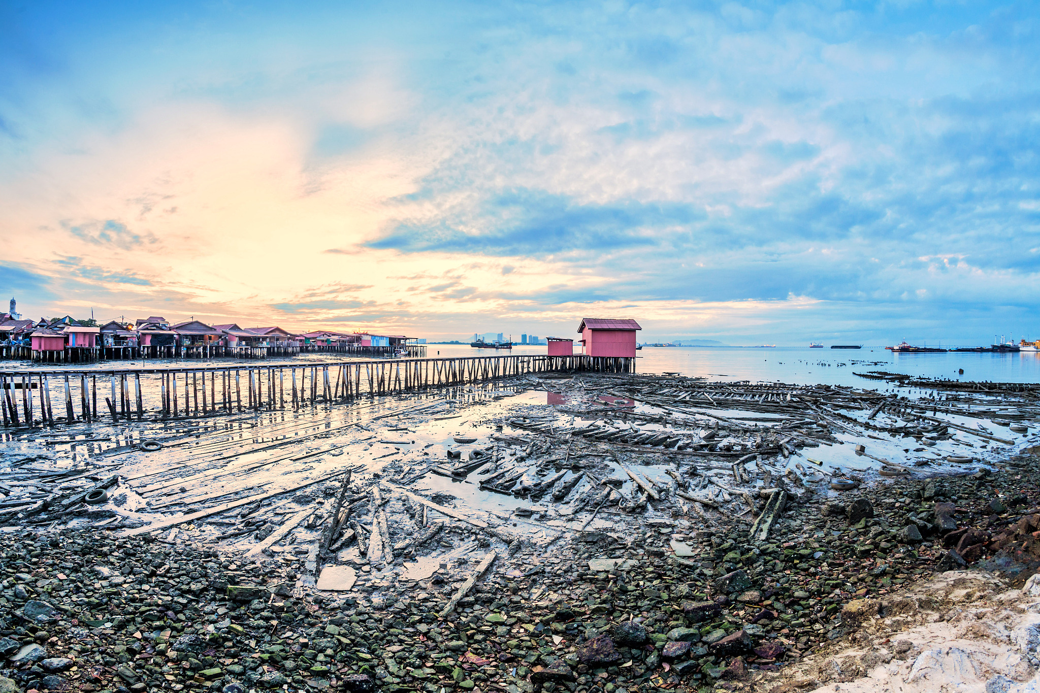 tan jetty of george town, penang view during sunrise with a hut