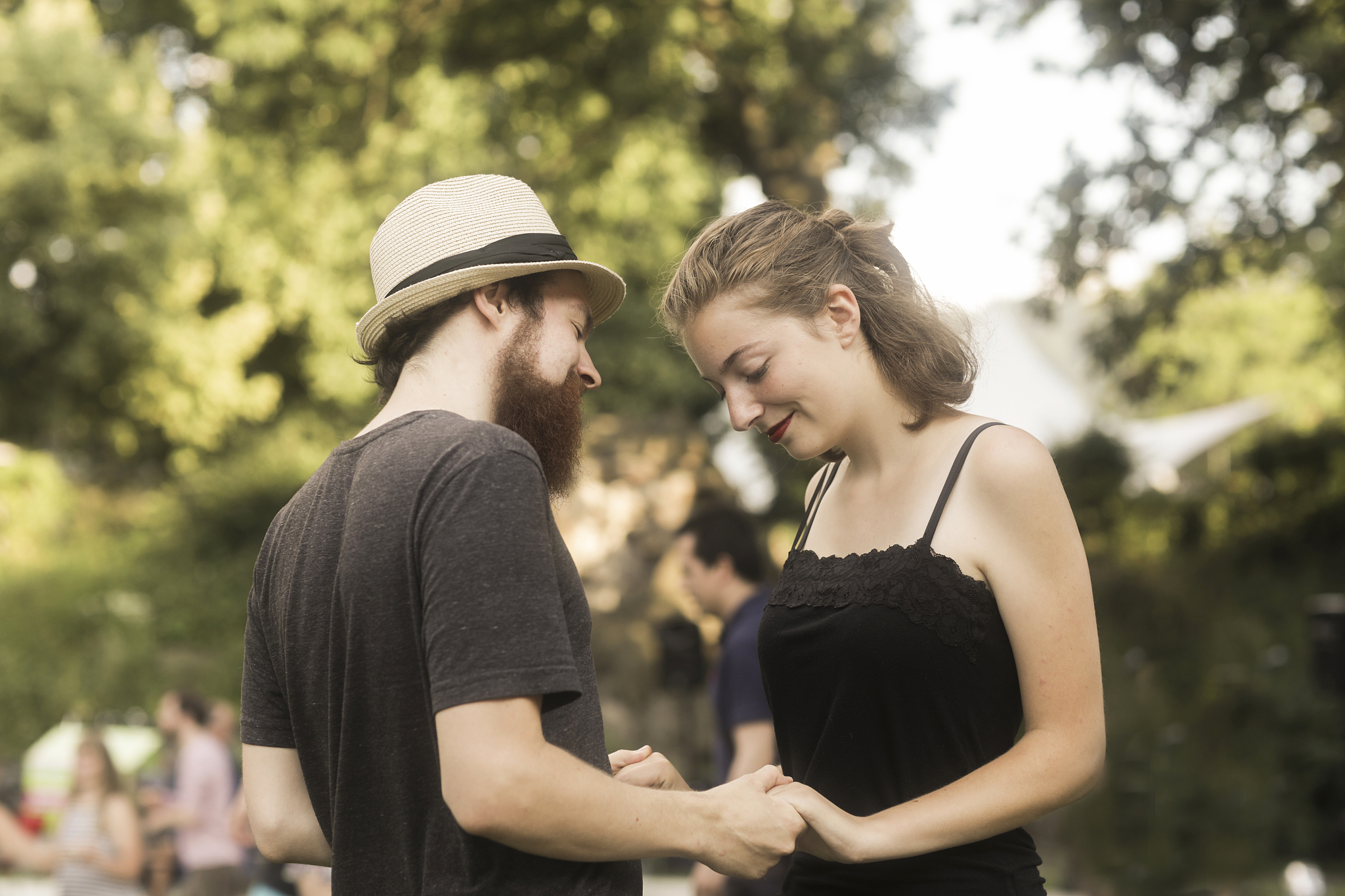 couple standing in a park holding hand