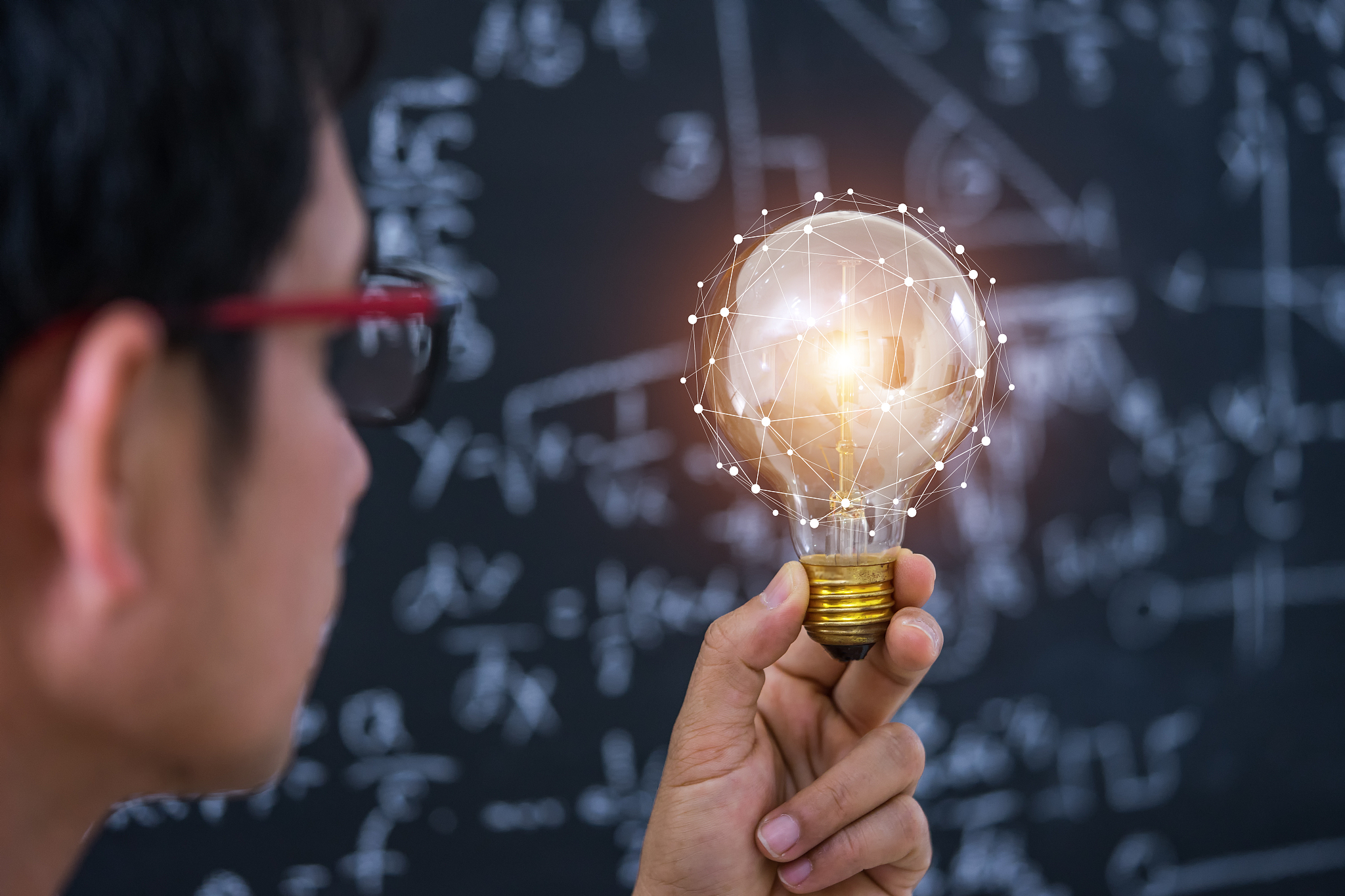 hand holding light bulb concept and education.
