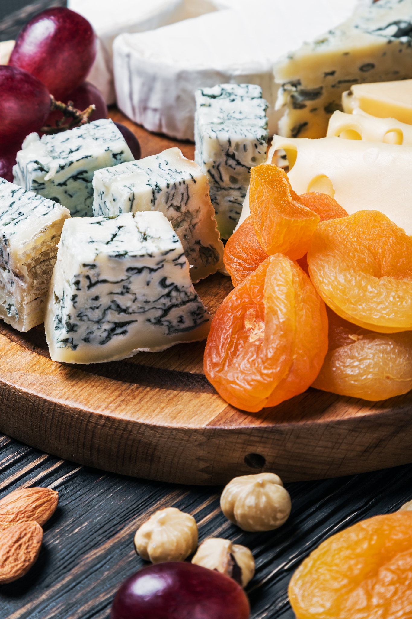 cheese plate with fruits and nuts