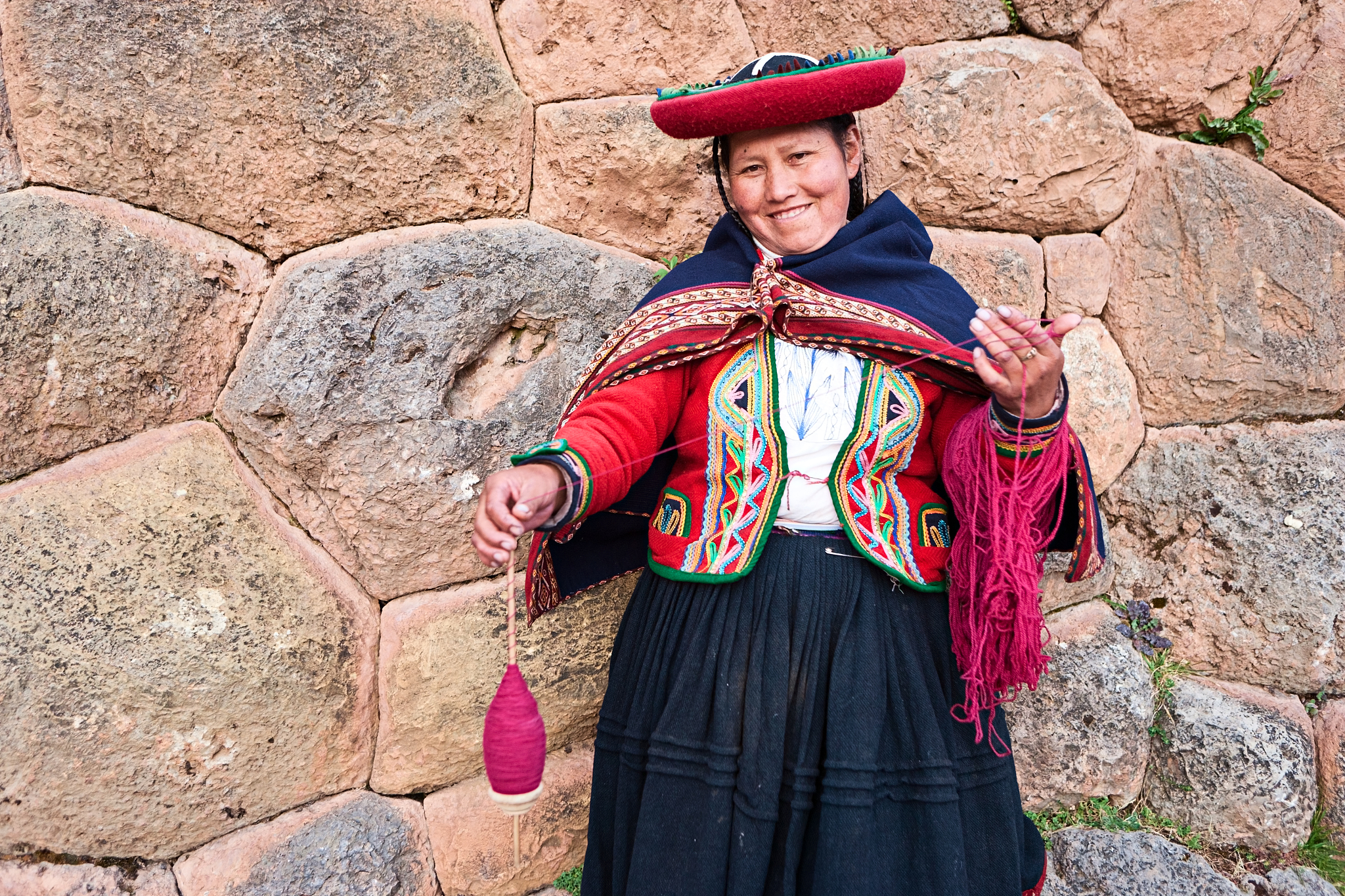peruvian woman spinning wool, the sacred valley, chinchero