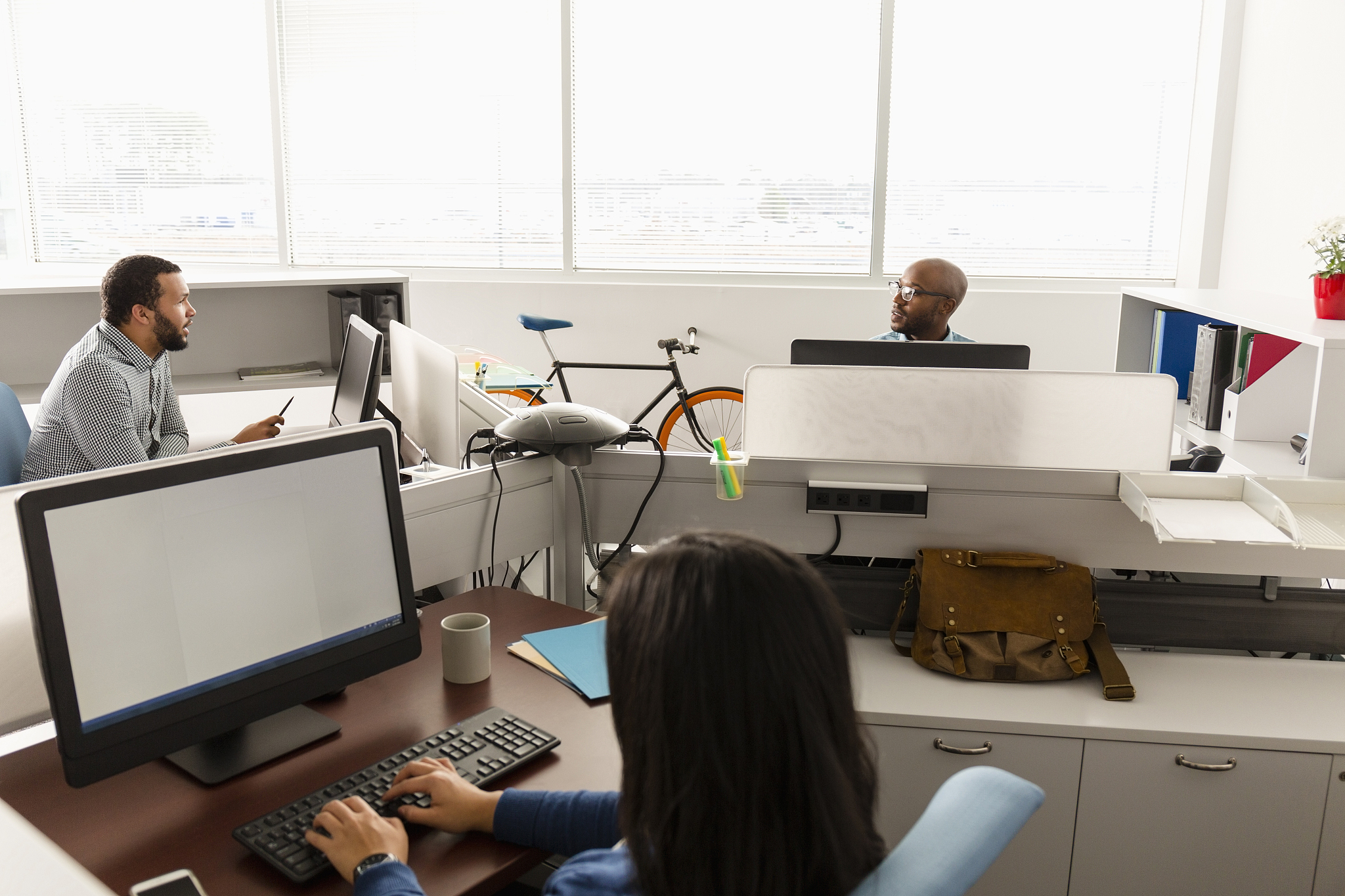 people working at computers in office