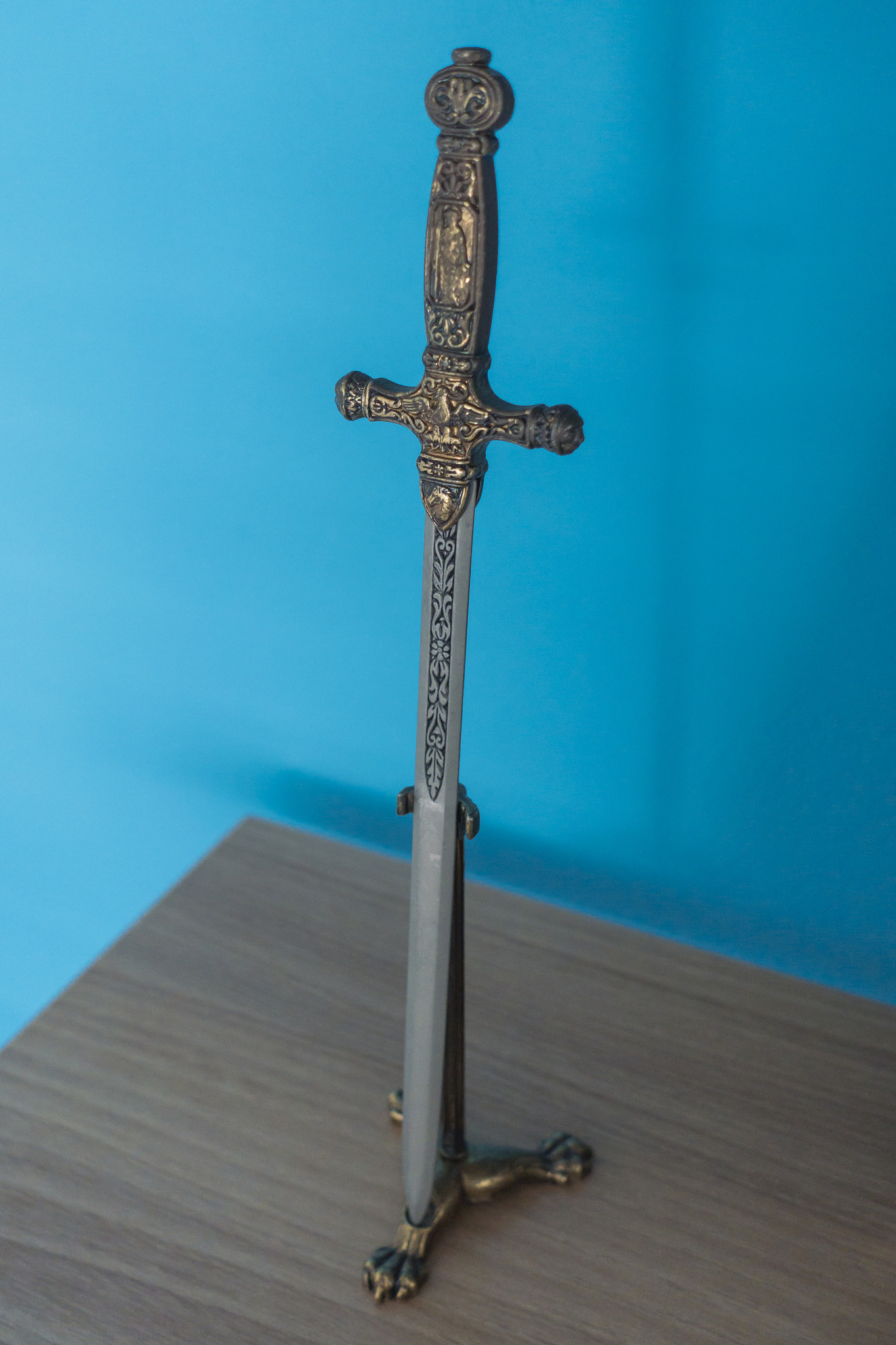 middle age model sword on the wooden shelf.