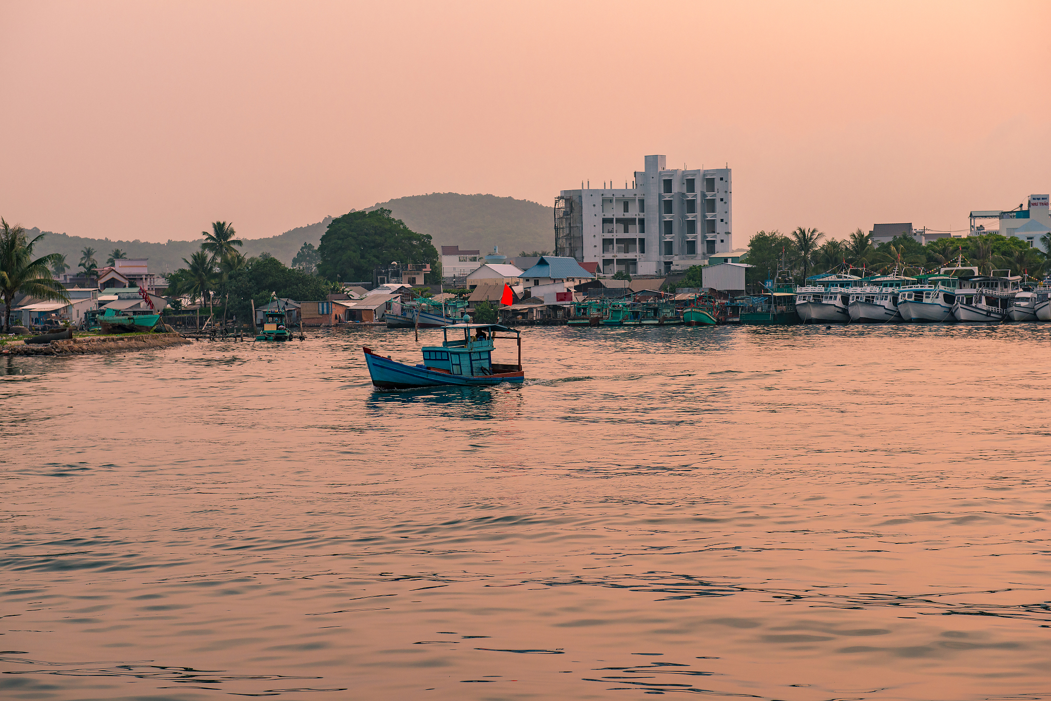 fishing boats are back to phu quoc harbor after the trip.