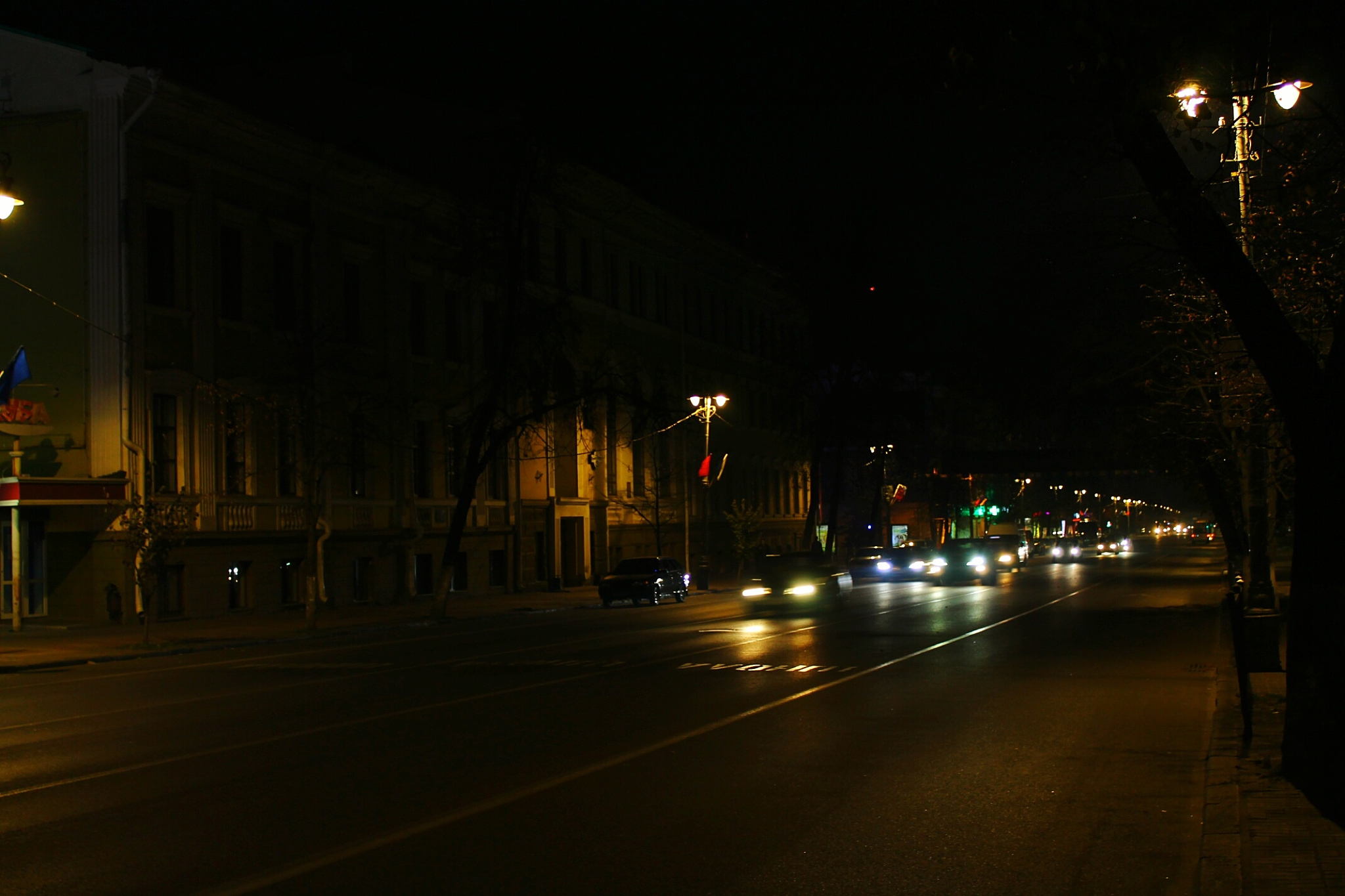 illuminated cars on street at night