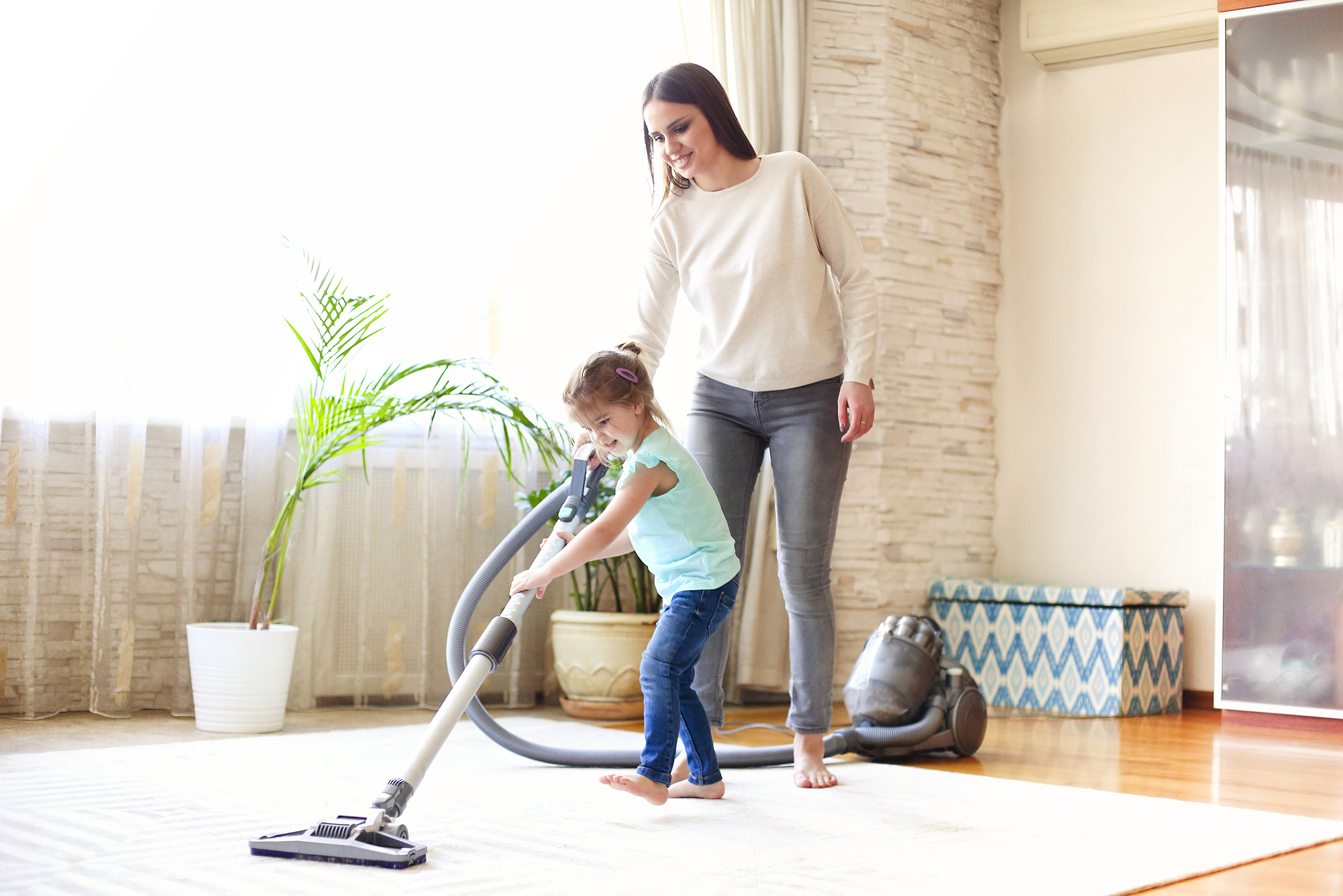 woman and girl cleaning floor together