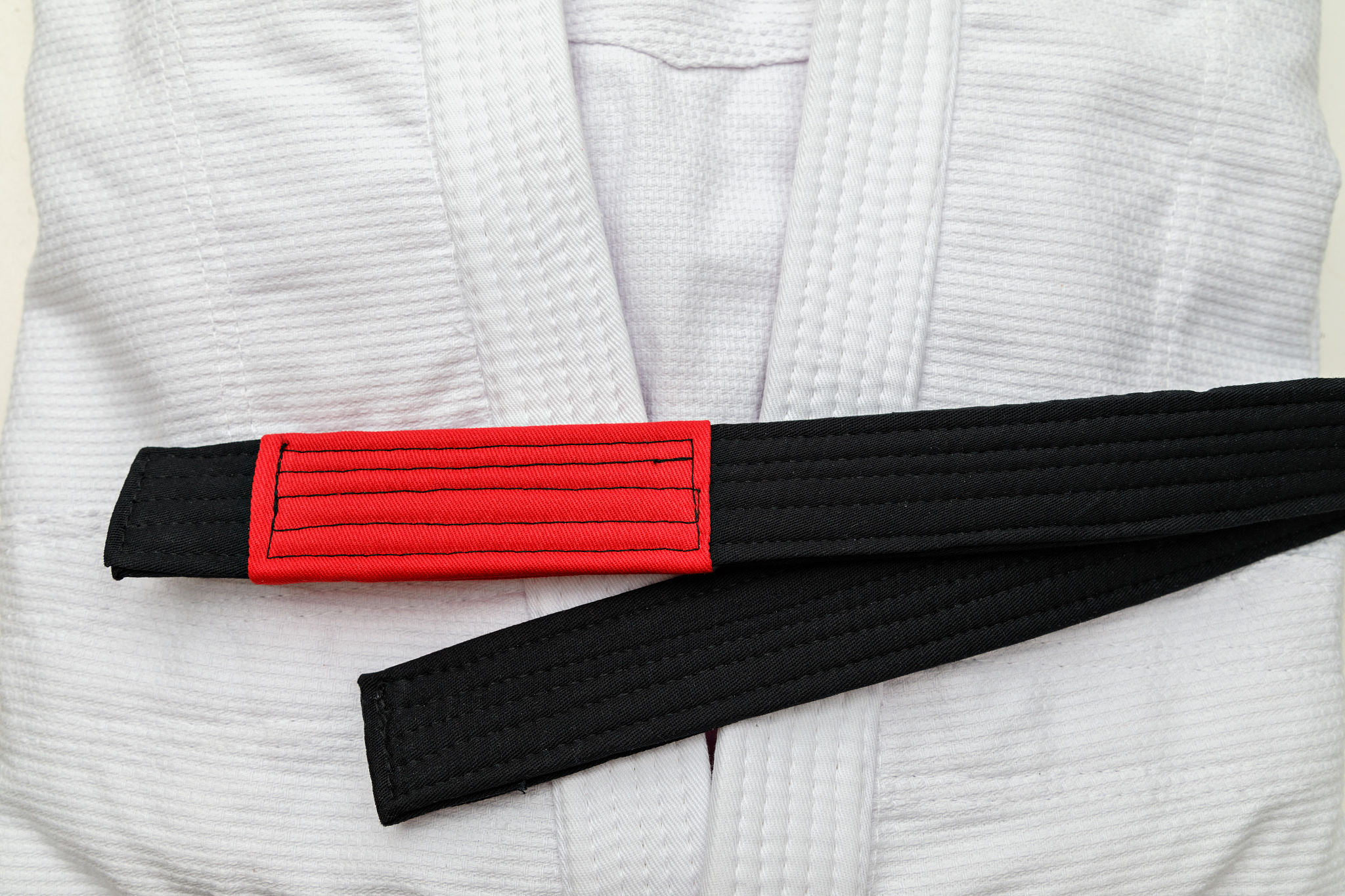 white kimono with black belt