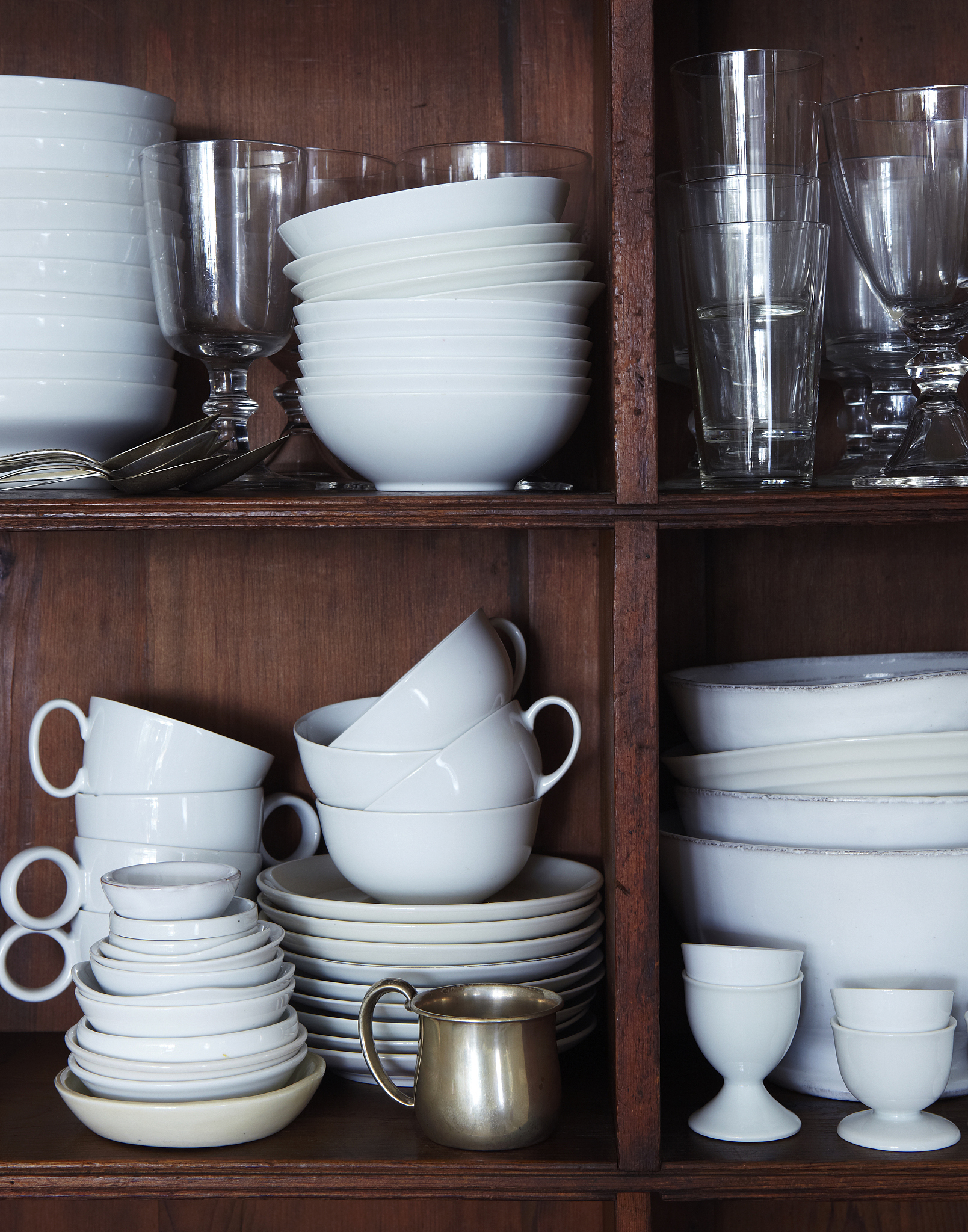 stacked kitchen utensils and glasses.