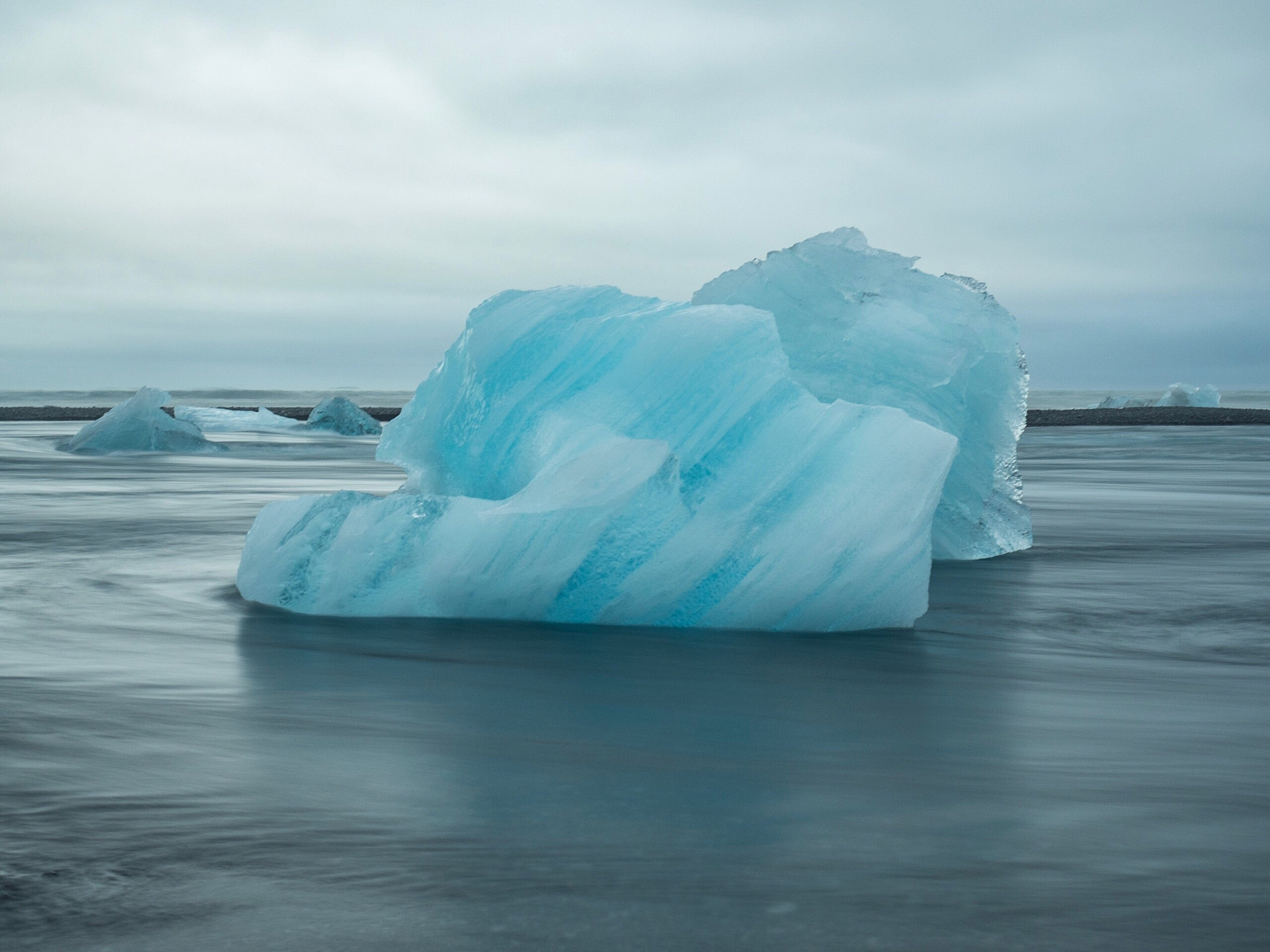 ice floating on sea against sky