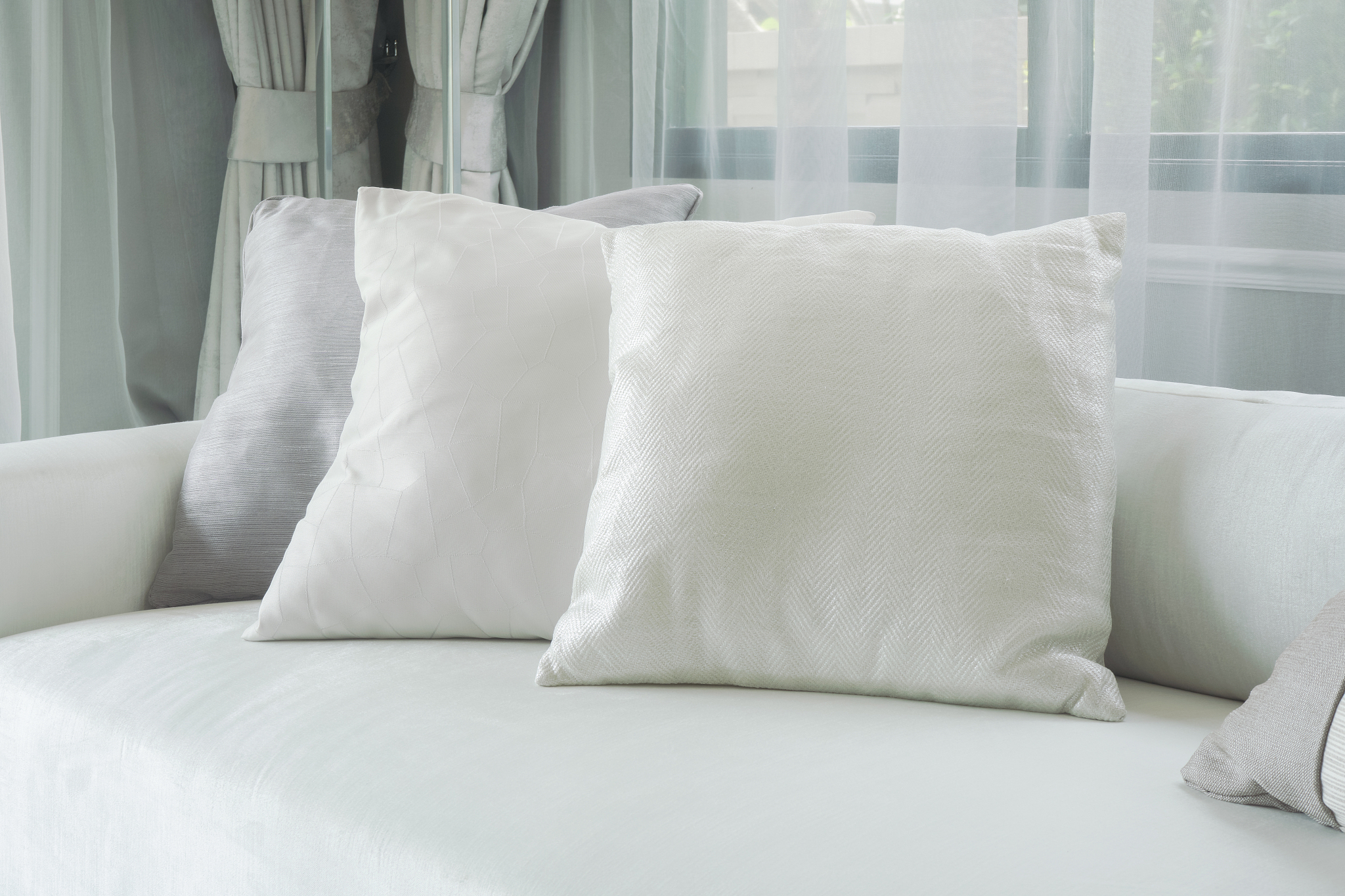 white pillows lay on sofa in modern style living room