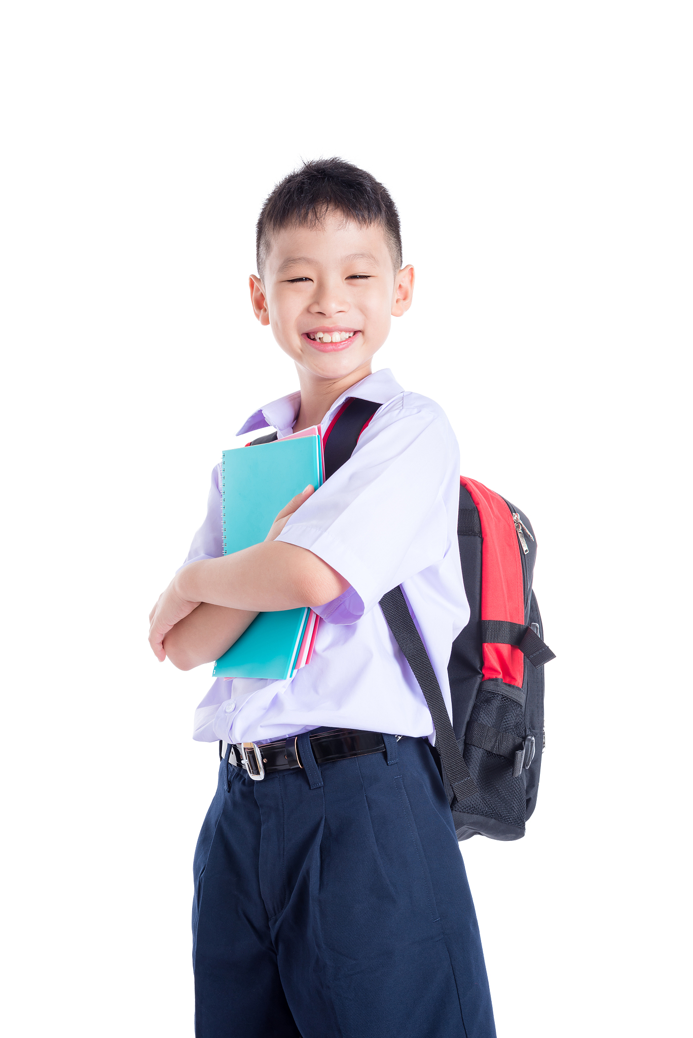 young student in uniform smiling over white