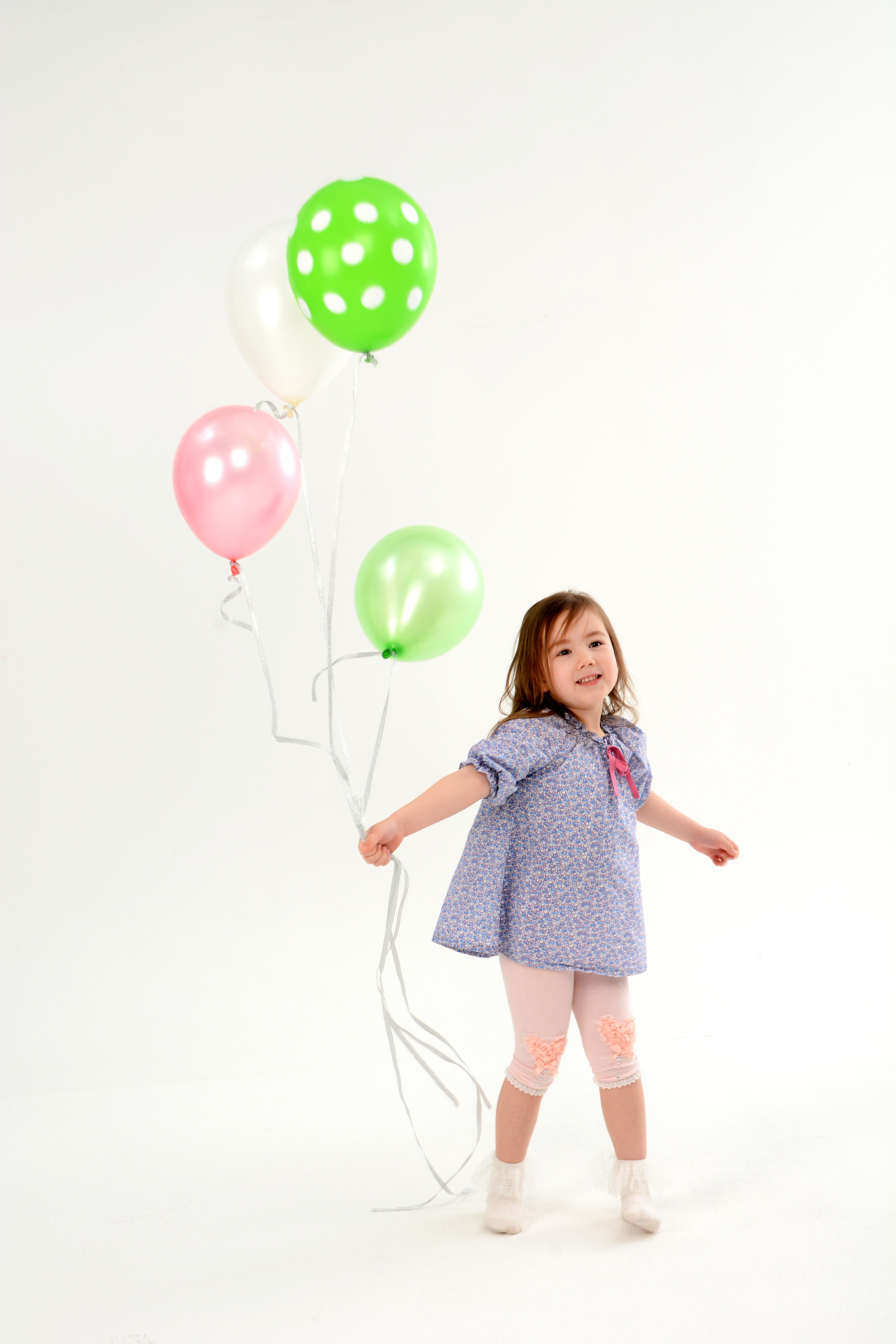 a child holding a balloon