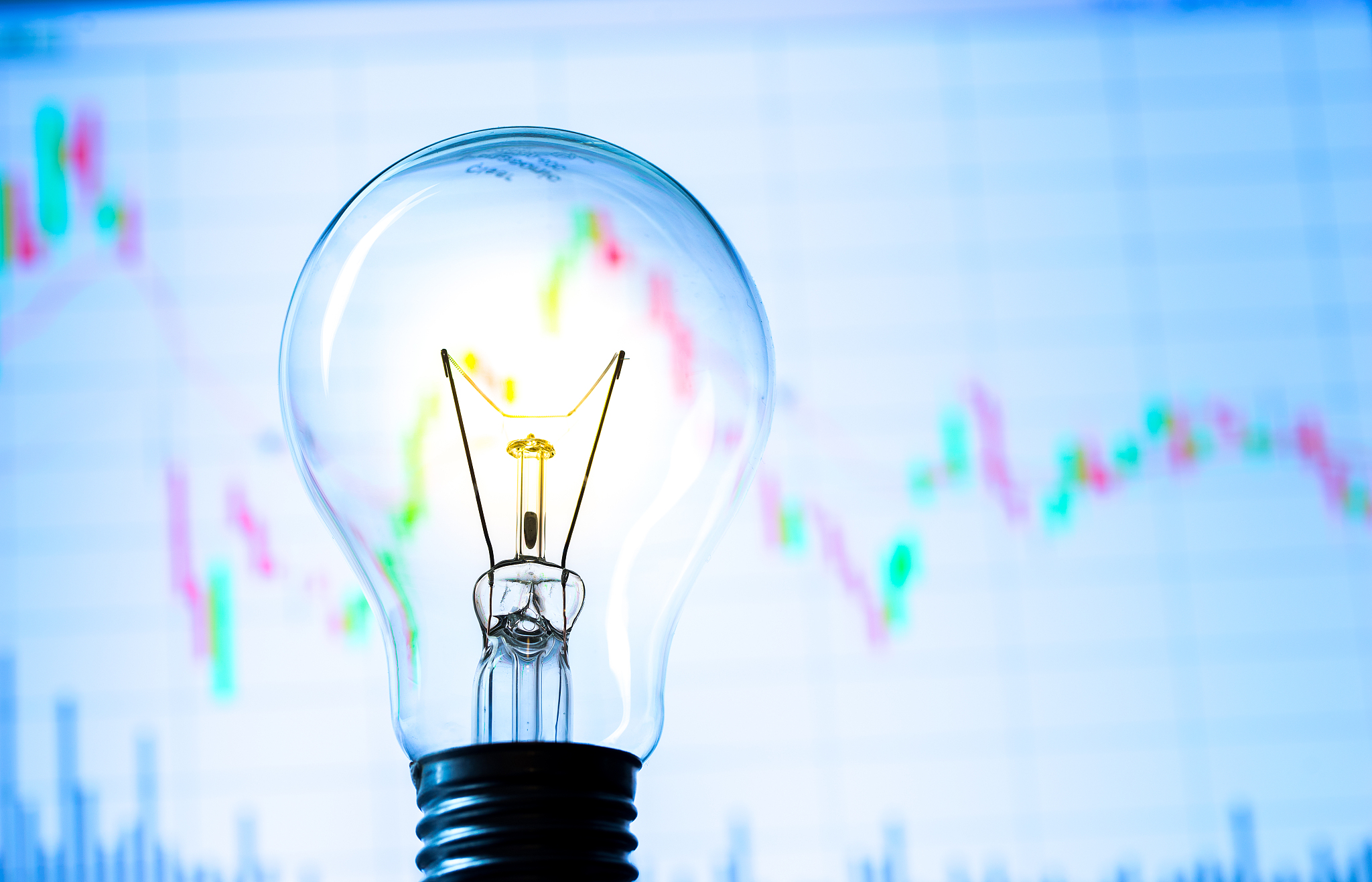 business success with stock graph and light bulb