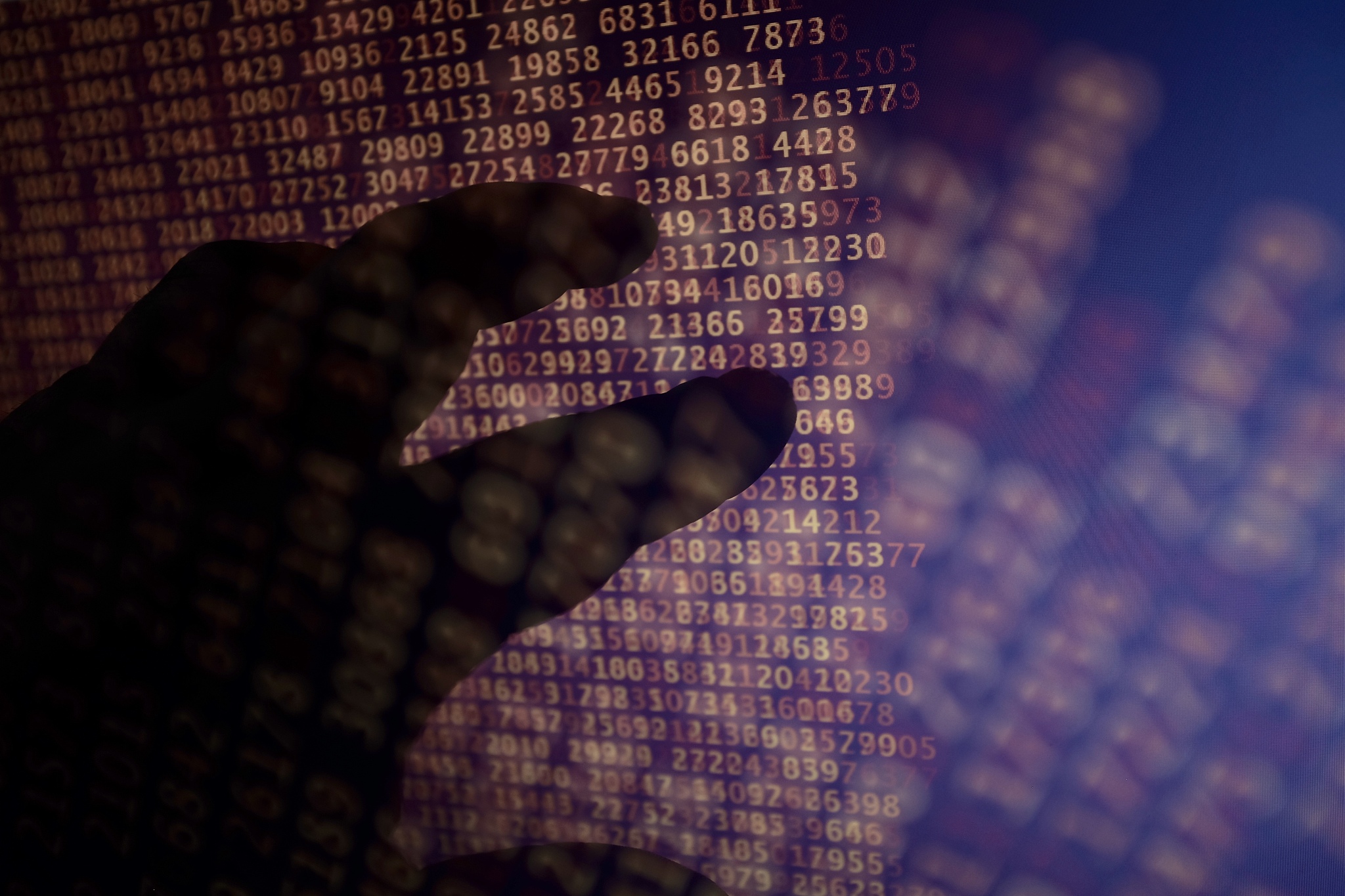 double exposure of cropped hand and binary codes
