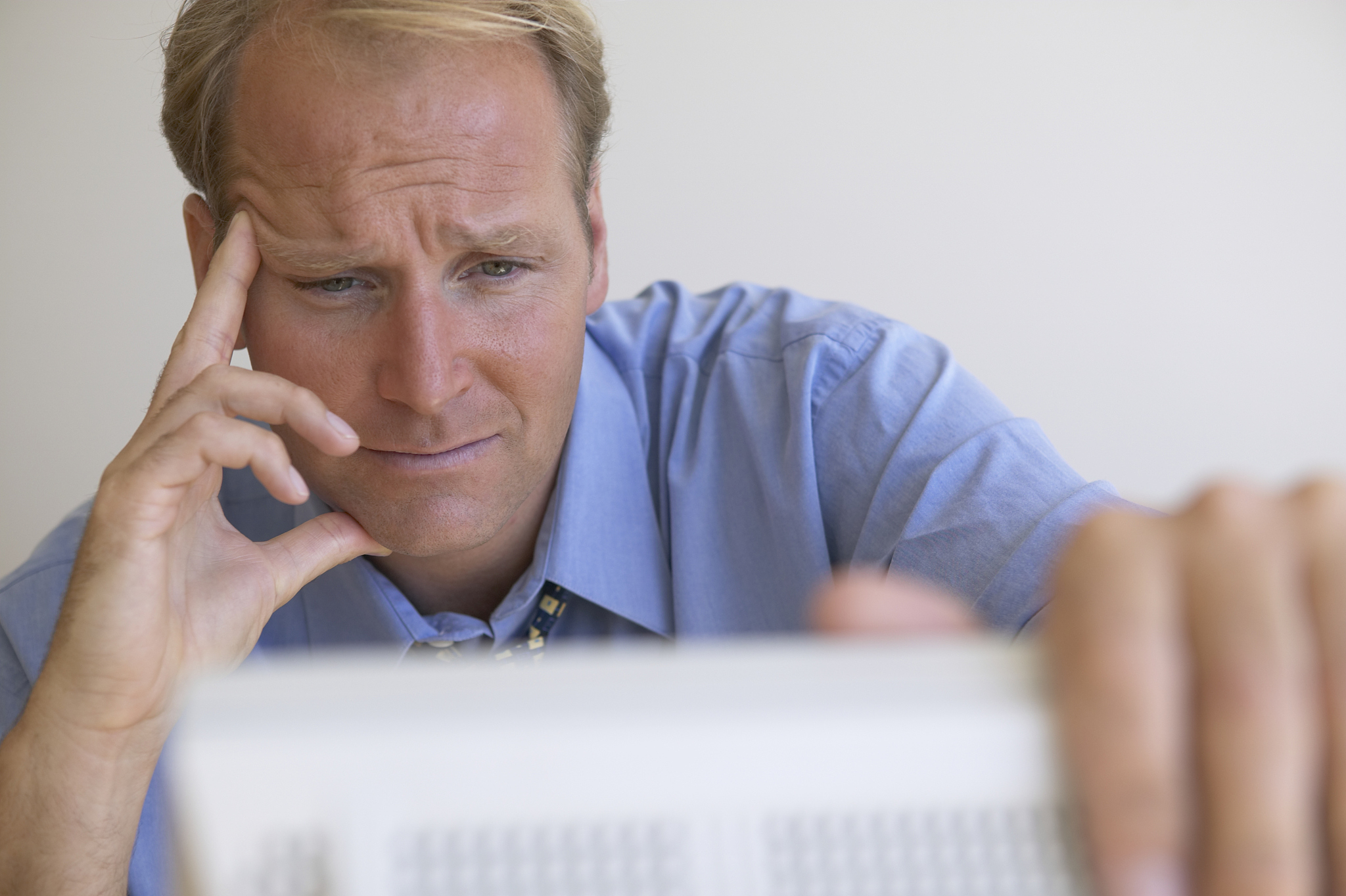 businessman reading computer monitor