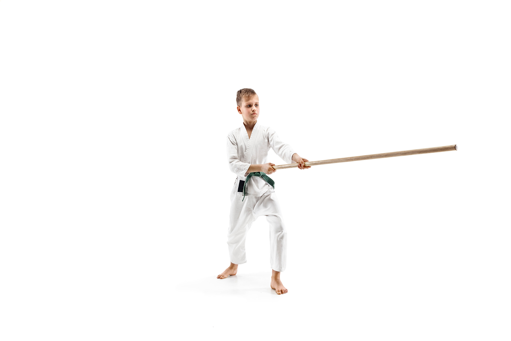 teen boy fighting with wooden swords at aikido training in marti