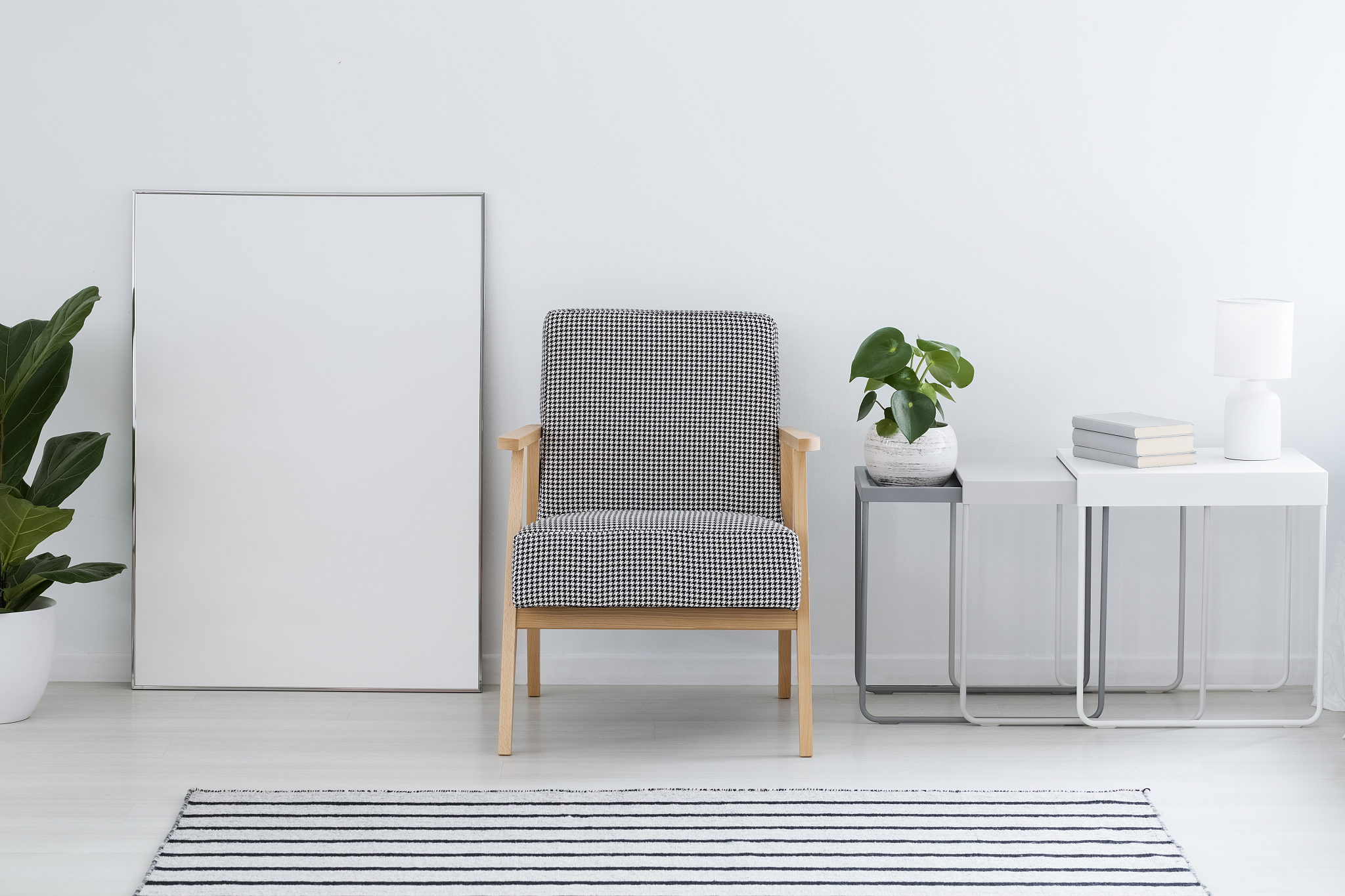 patterned armchair next to empty poster in white flat interior w
