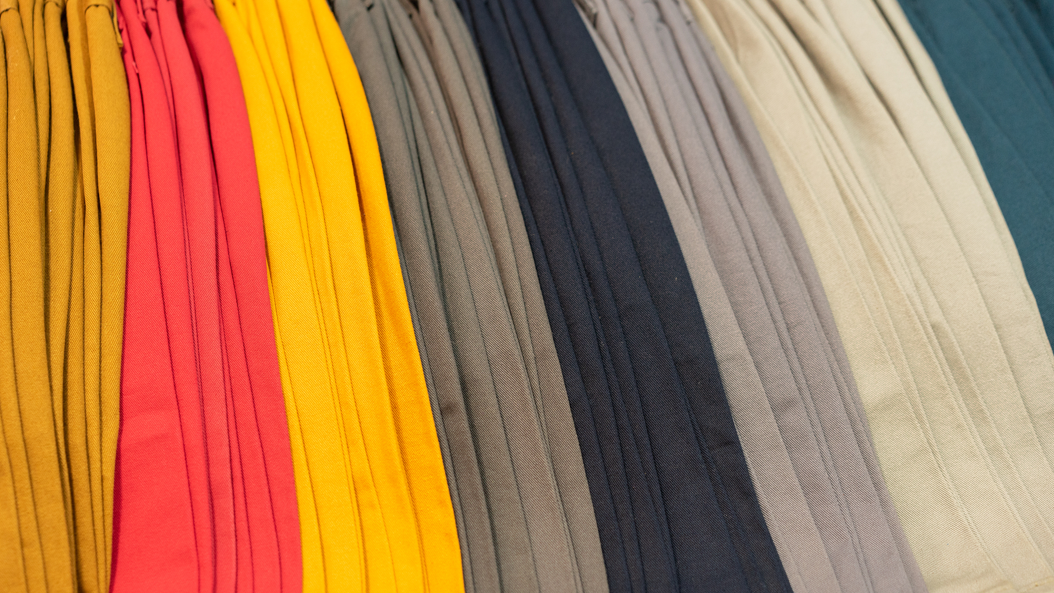 stack of colorful shorts pants in the shopping mall, clothes ,sa