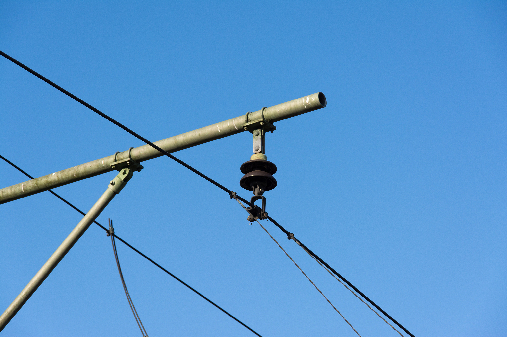 catenary pylon against blue background detail