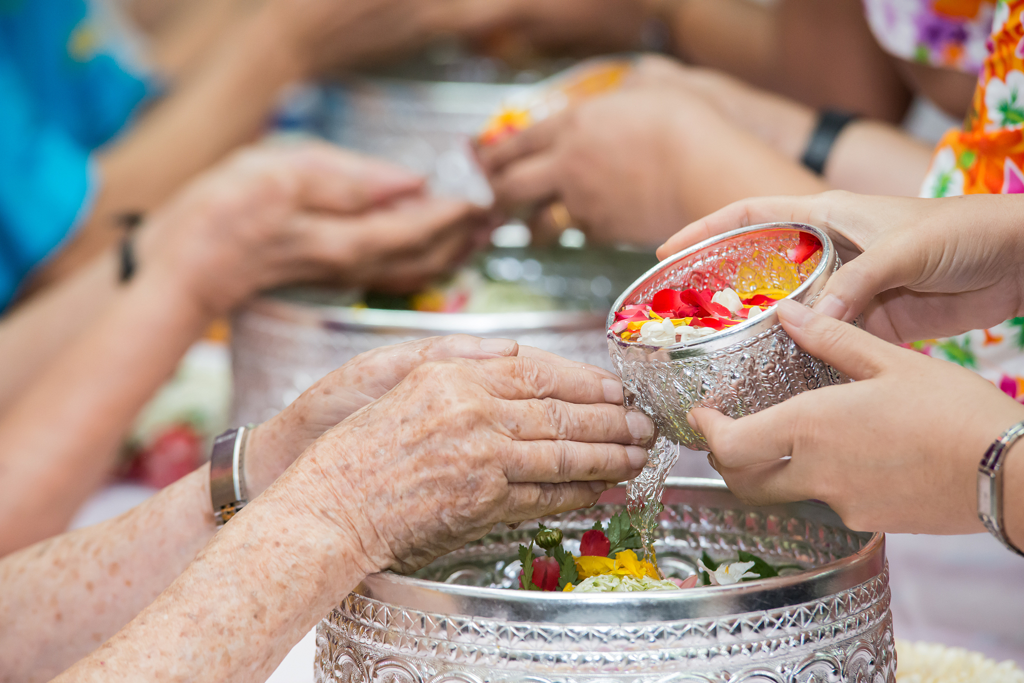 pour water on the hands of revered elders