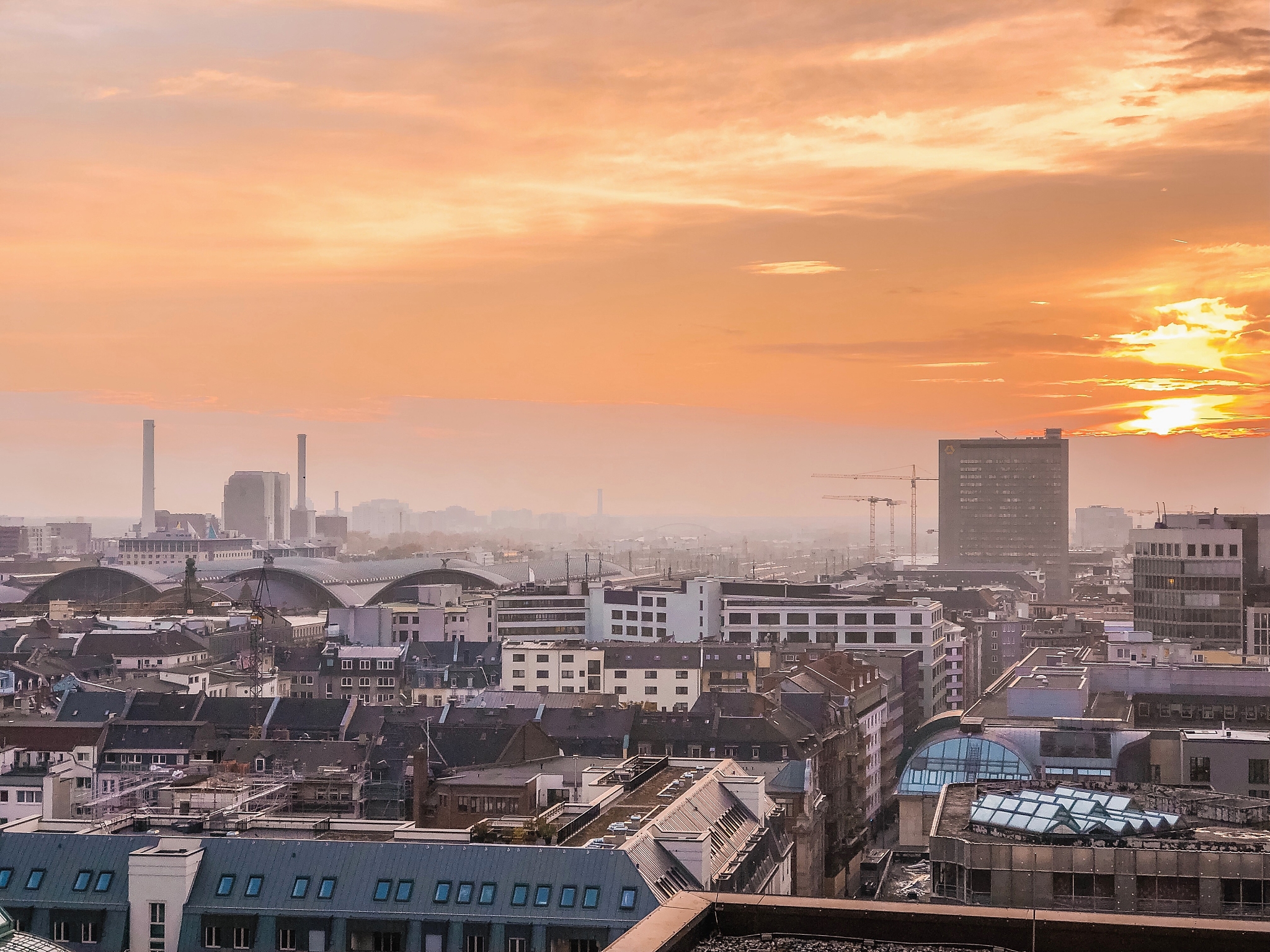 high angle view of buildings against sky during sunset