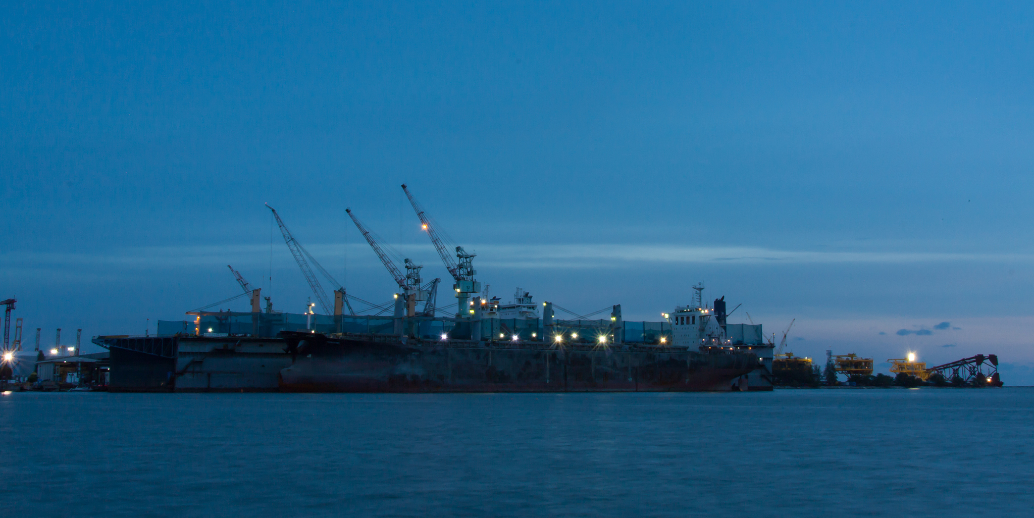 cargo ship in the harbor at sunset ,thailand