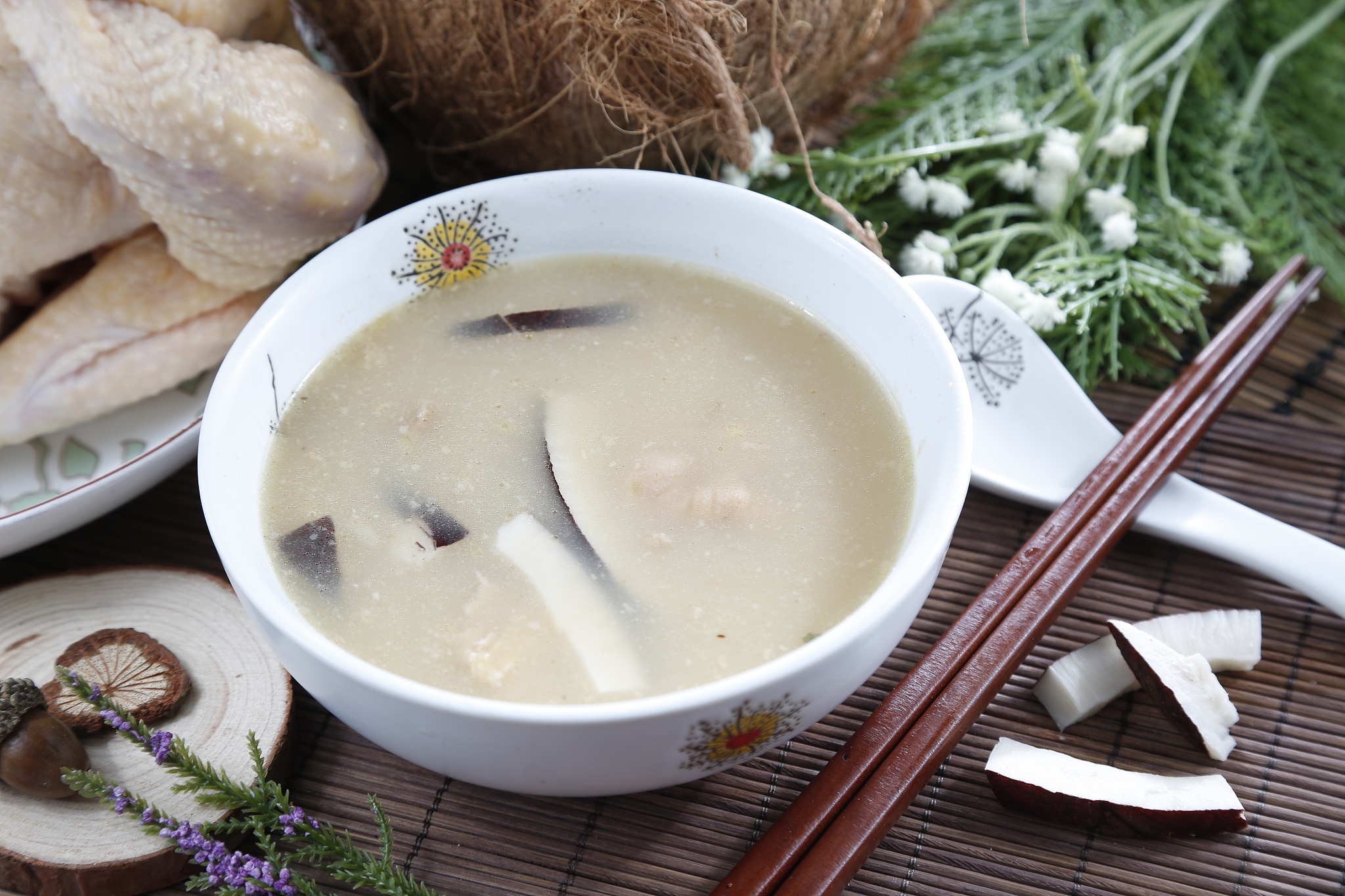 traditional chinese bowl of coconut soup on the table in
