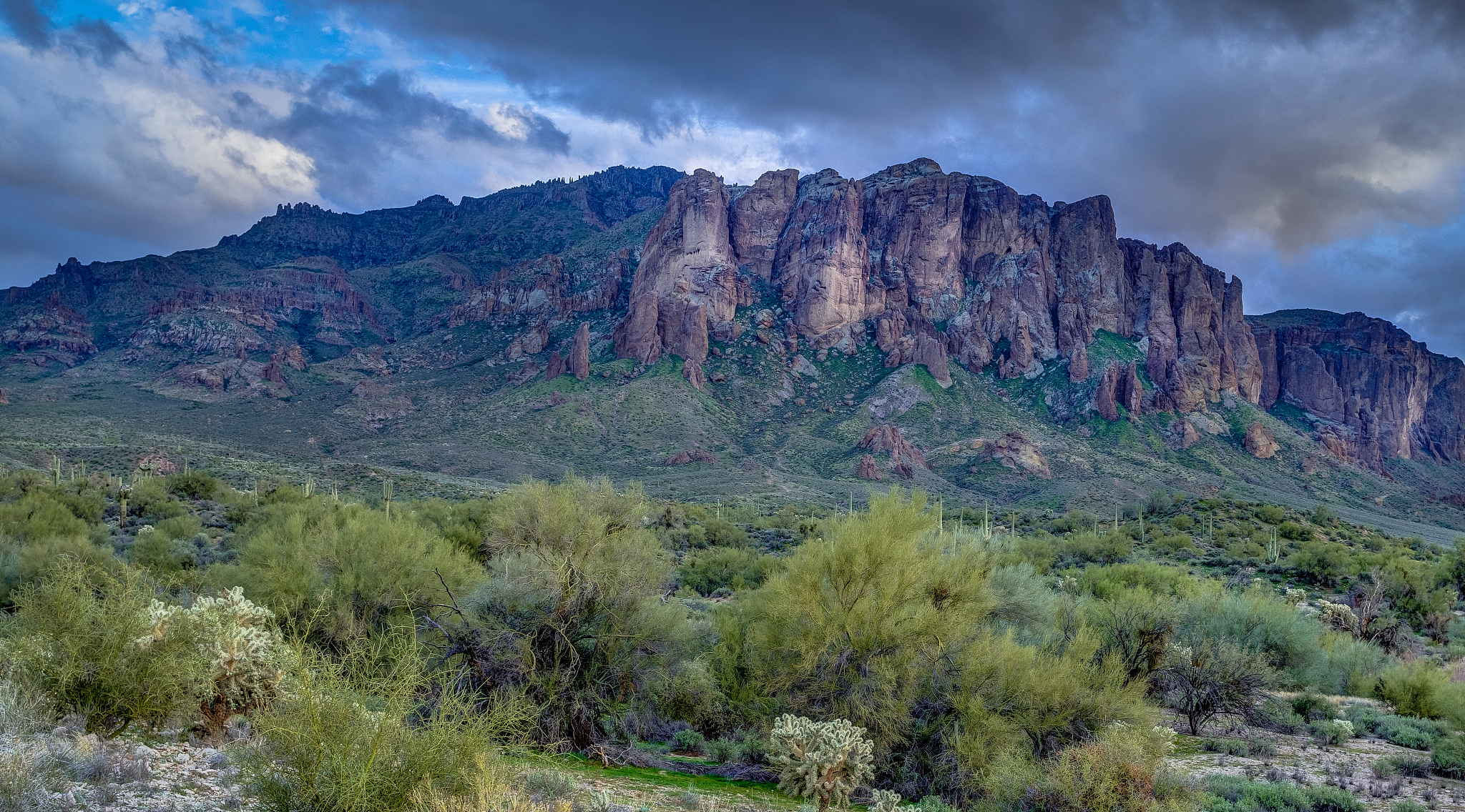 sun sets on the superstition mountains