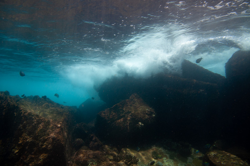 underwater landscape with rocks exit to the surface and bubbling