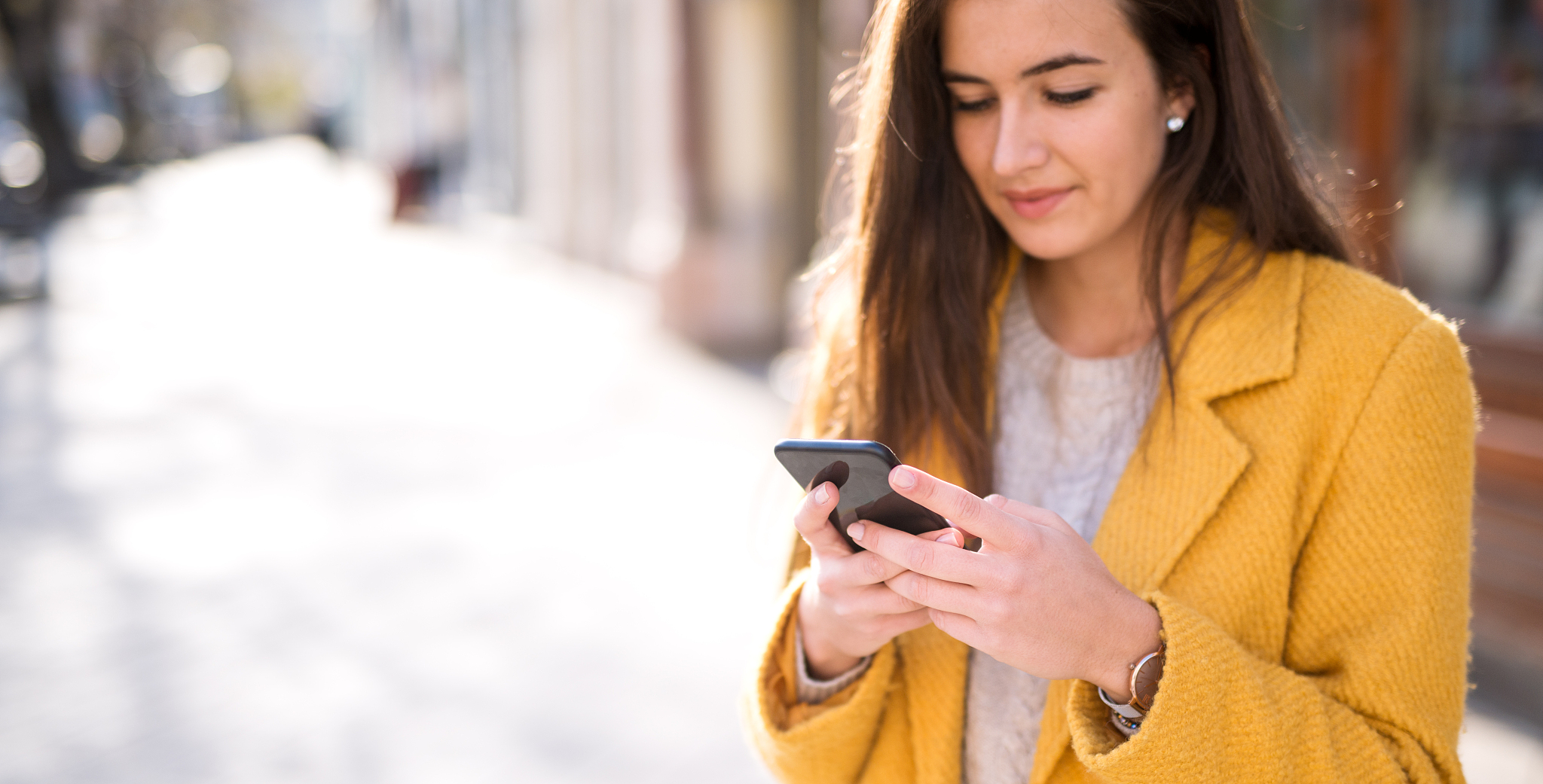portrait of a beautiful woman using a mobile