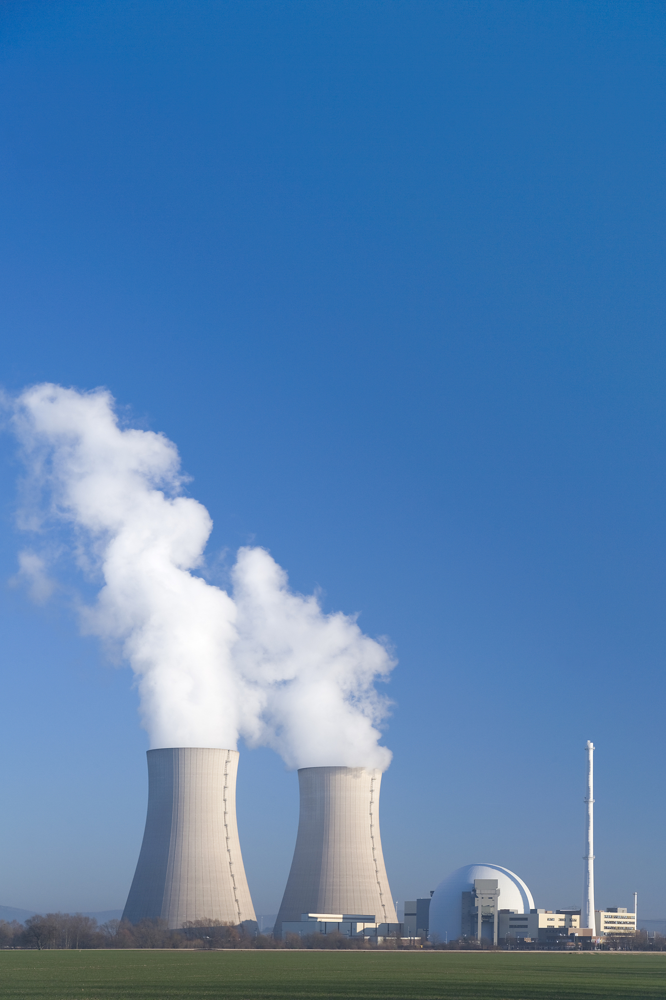 nuclear power station grohnde with steaming cooling towers