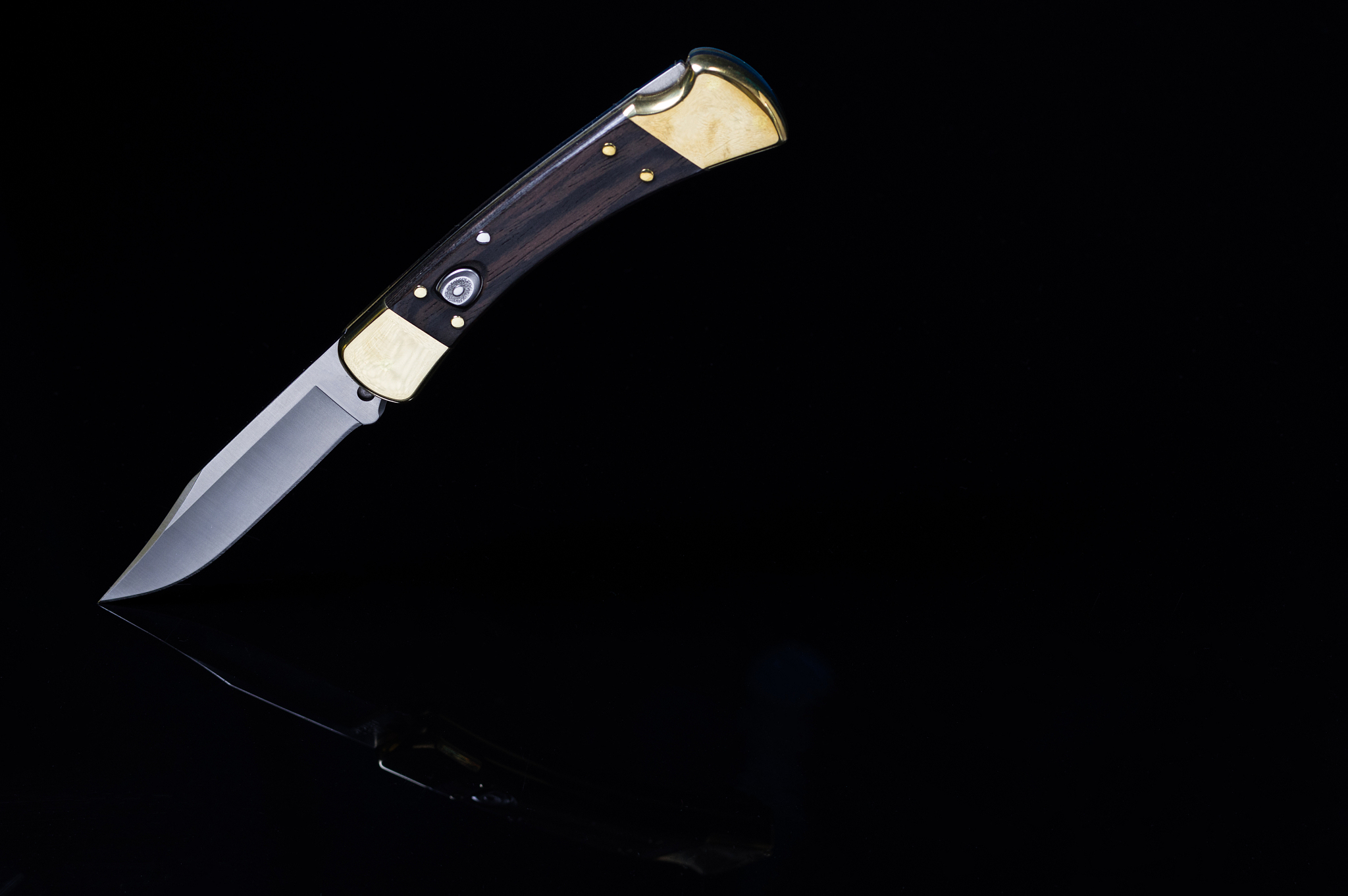 hunting knife on a black background. top view of the knife.