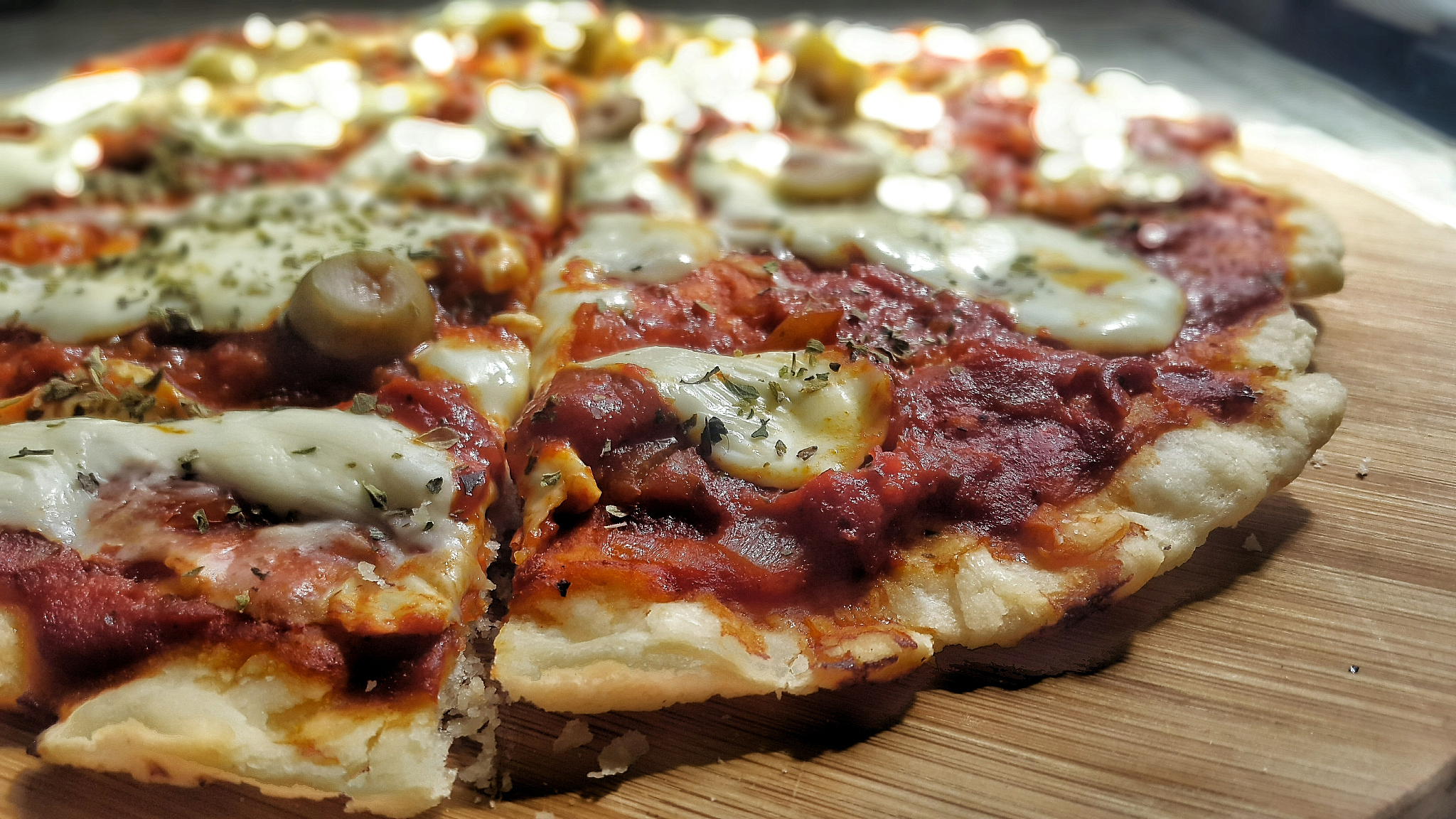 close-up of pizza on cutting board