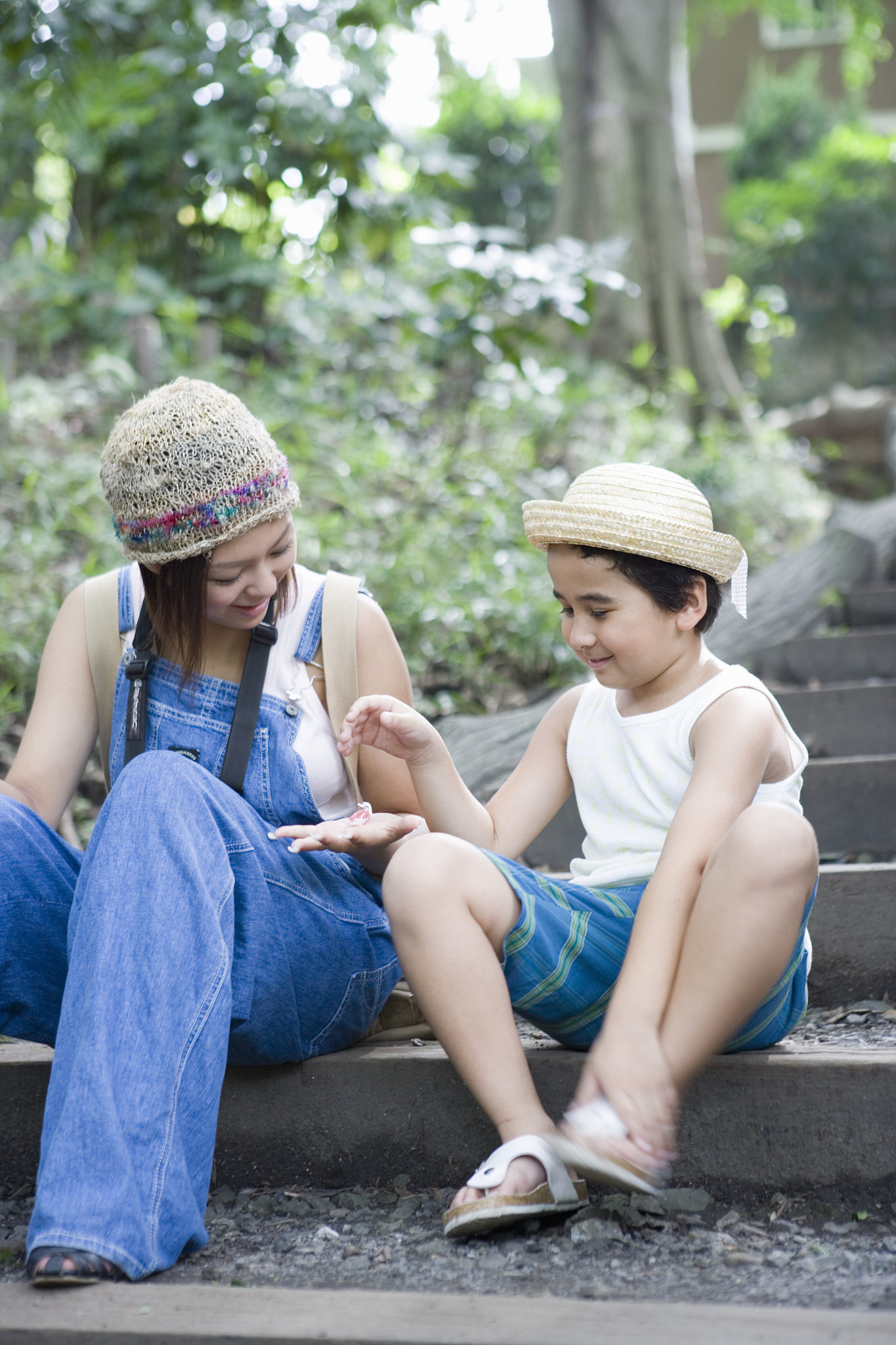 a girl and a boy sitting on the staircase