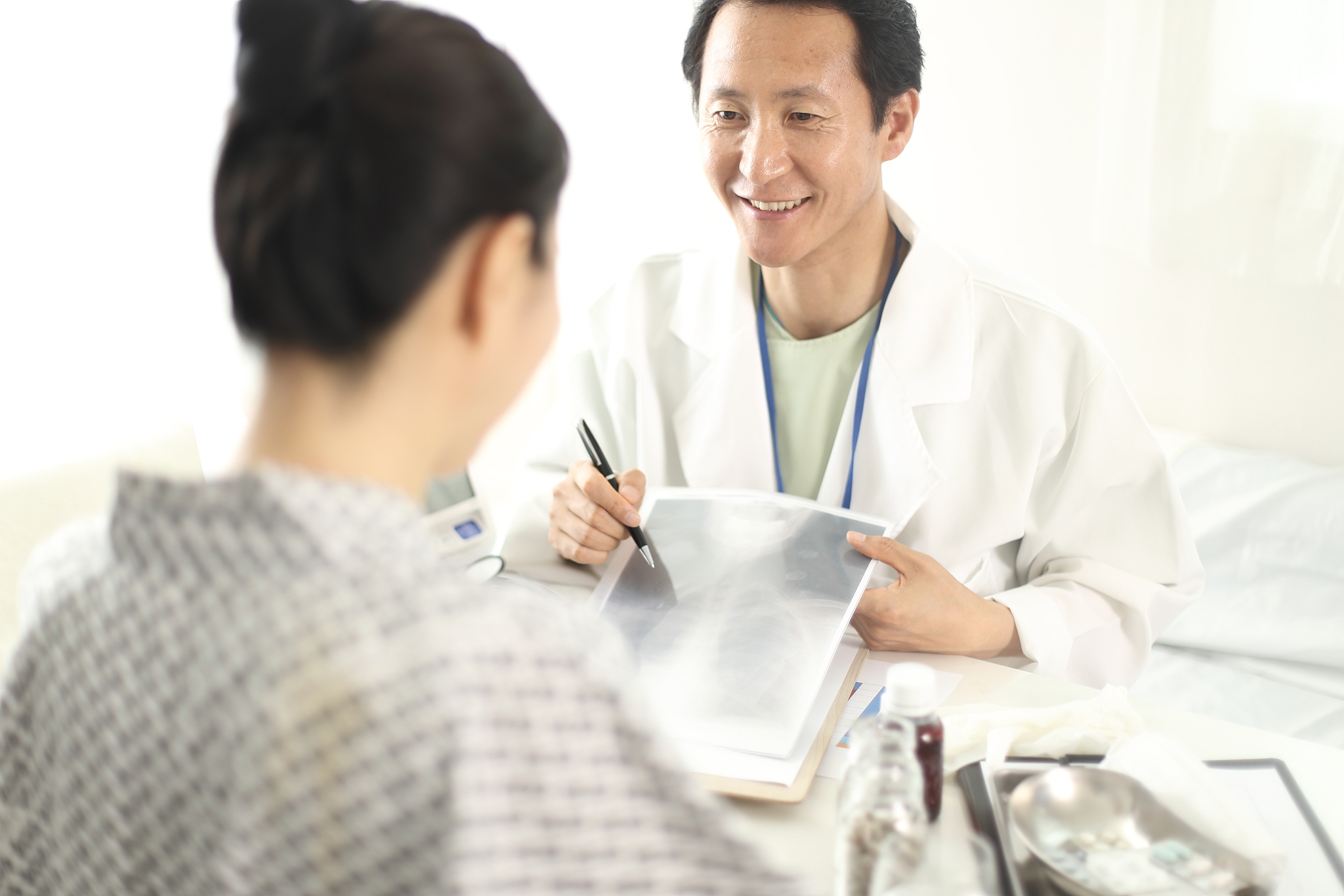 doctor showing xrays to his patient in medical office