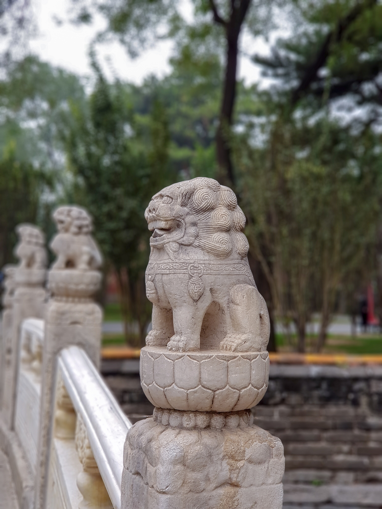 stone guardian lion statue in bridge, forbidden city