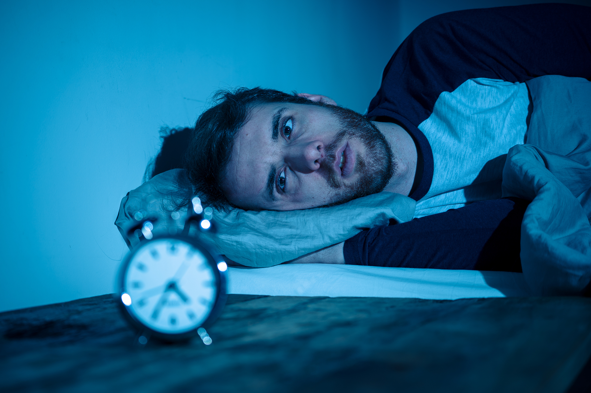 sleepless and desperate young caucasian man awake at night not a
