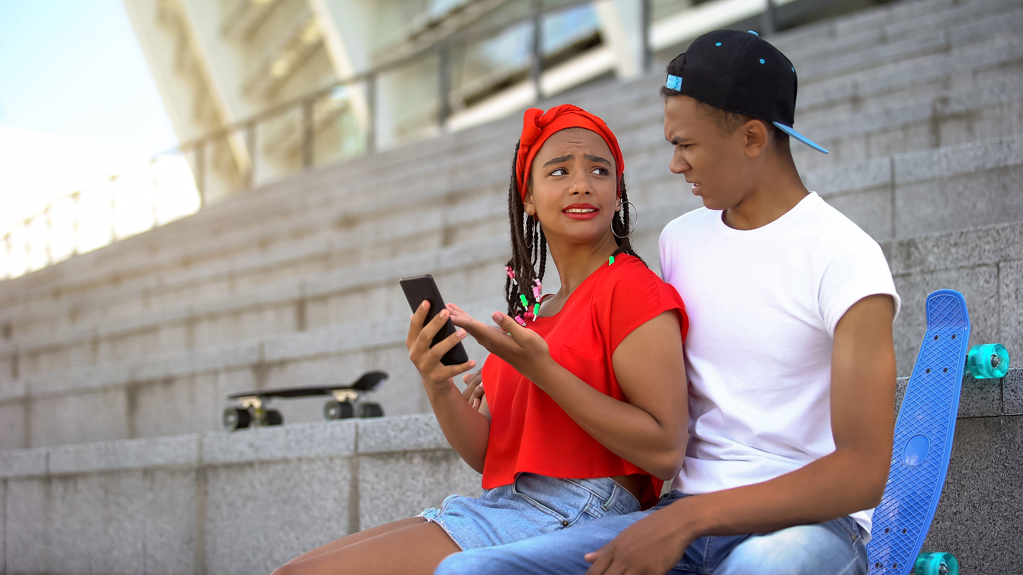 mixed-race girl upset with negative feedback in social network, 