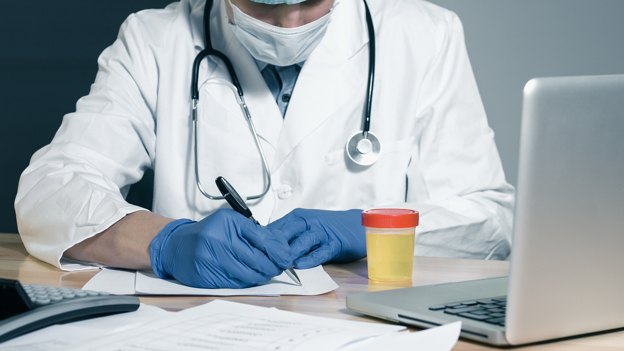 doctor examining urine test