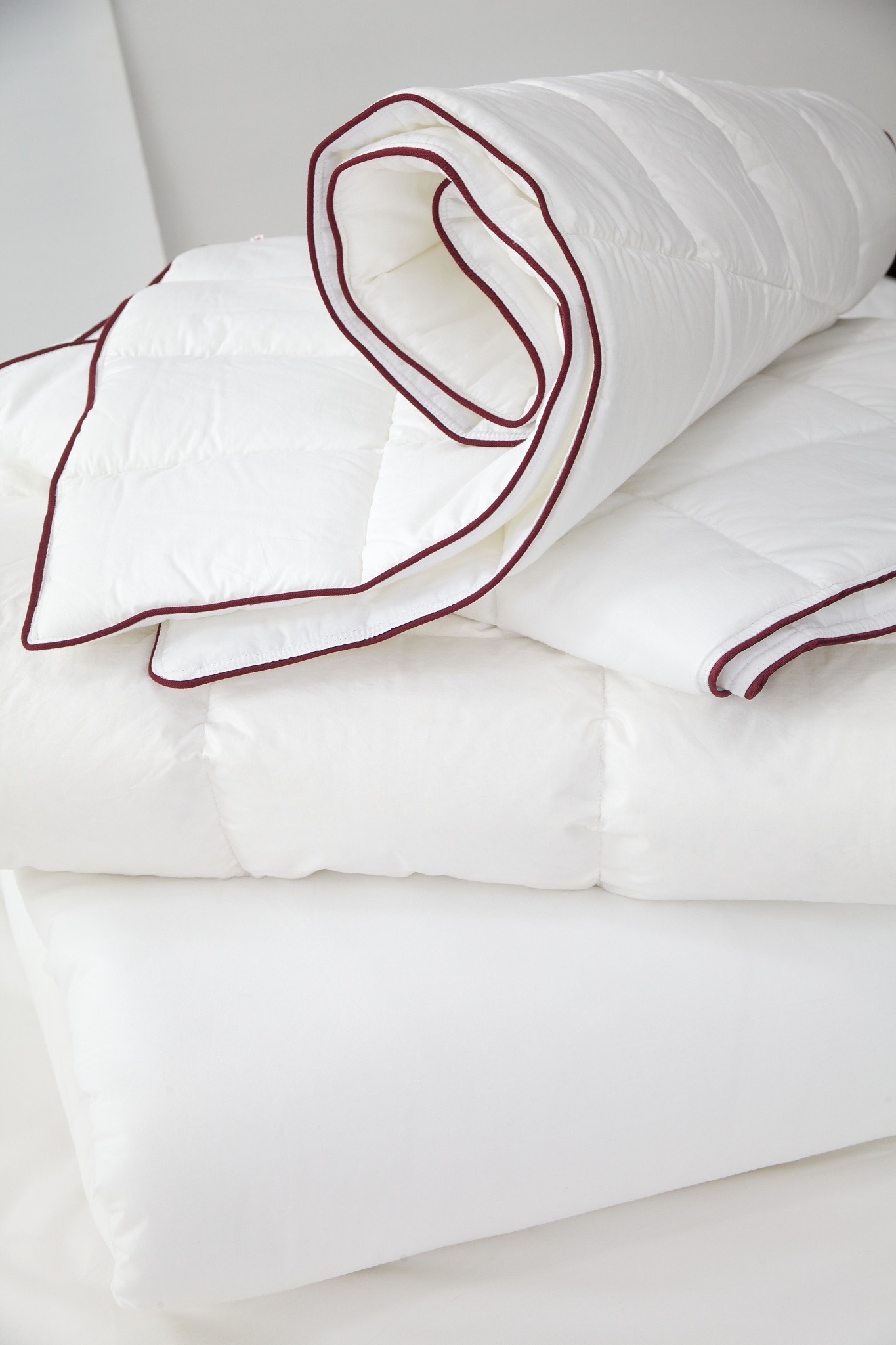 rolled new blanket on bed
