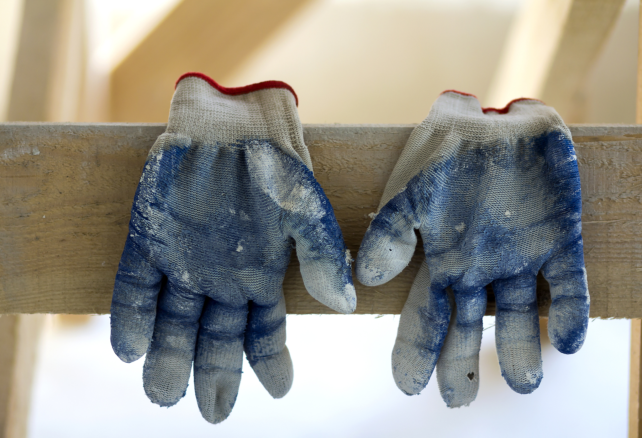 used old dirty torn worker's gloves as a metaphor, concept or sy